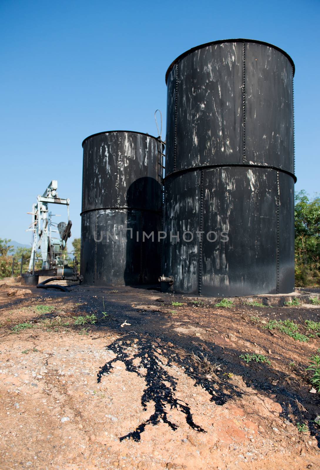 pump jack with crude oil contaminatate to environment