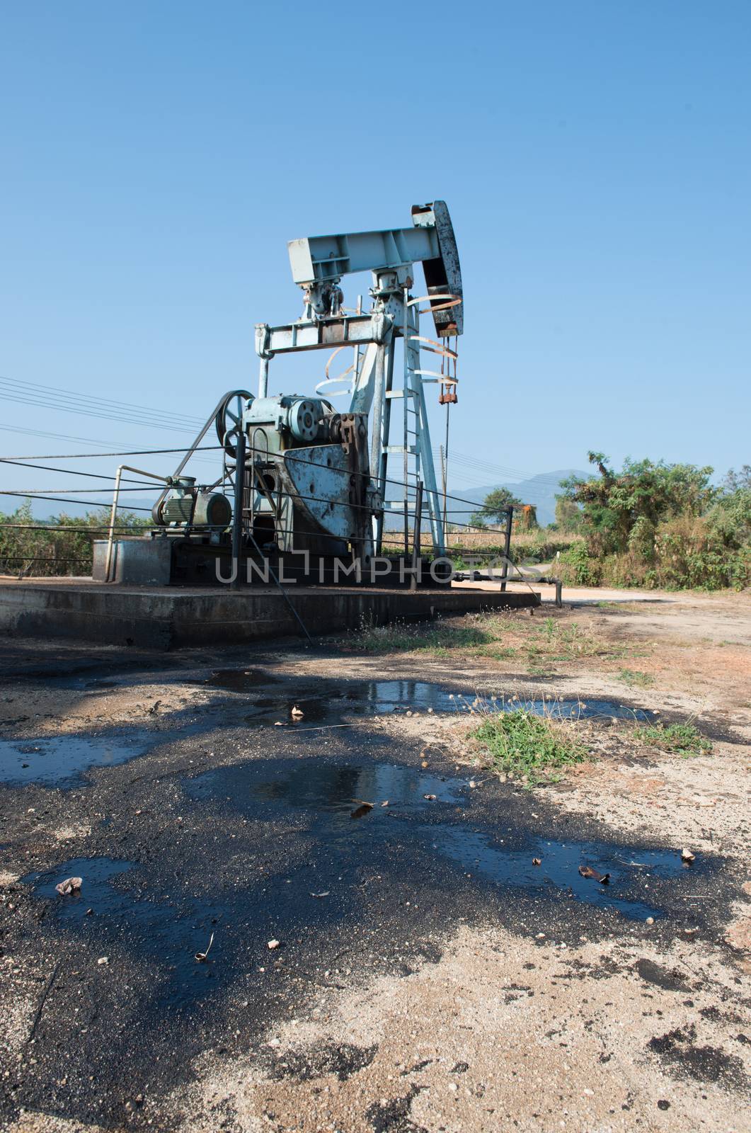 pump jack with crude oil contamination by anankkml