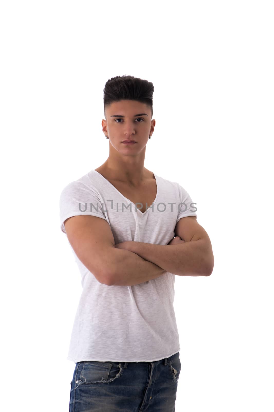 Portrait of trendy young man in white t-shirt and jeans with arms crossed on chest, isolated on white