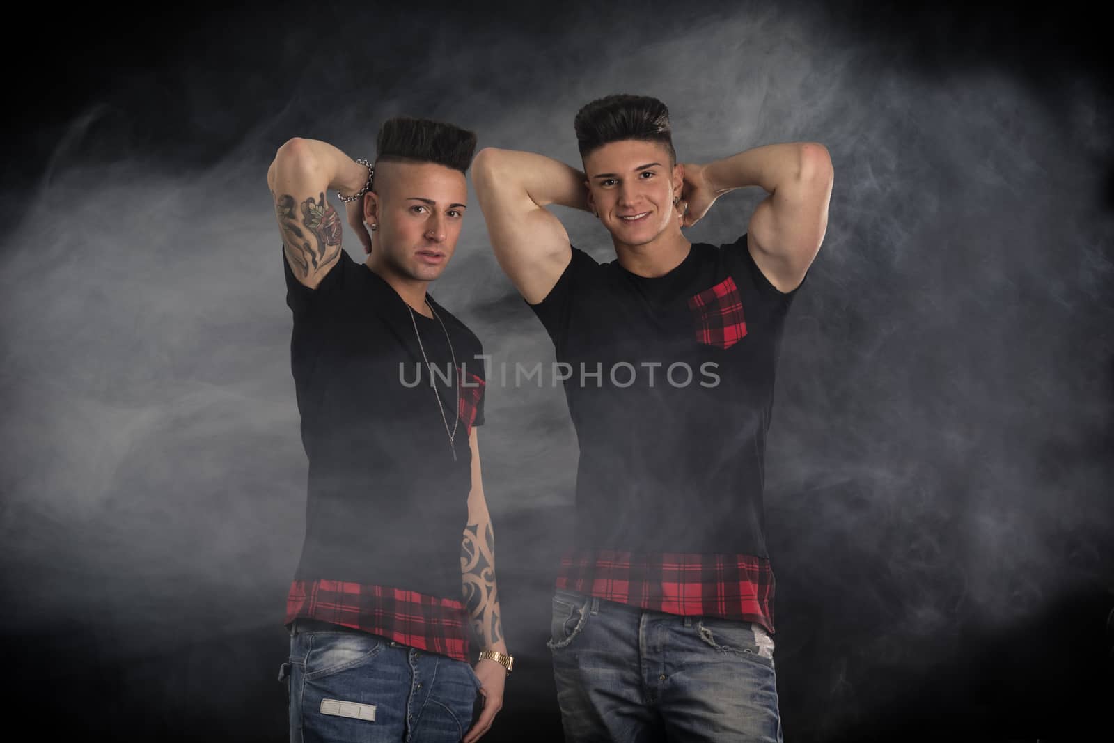 Two hip trendy male friends in studio shot by artofphoto