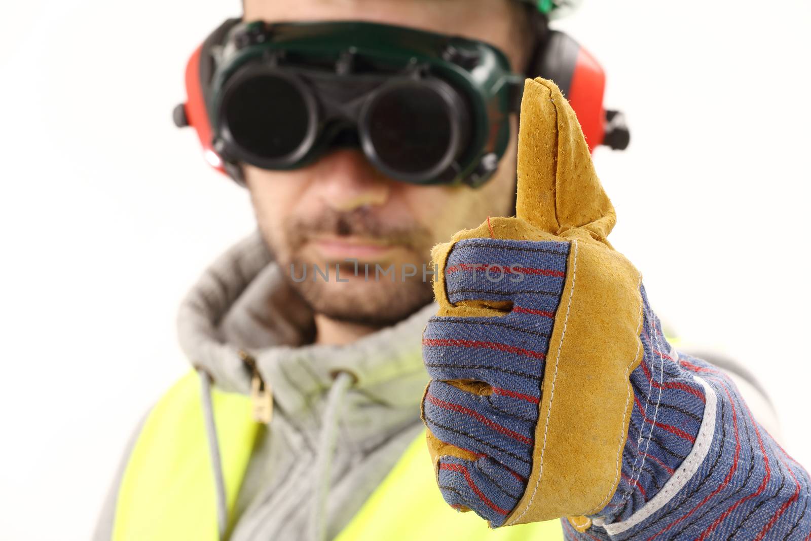 Worker with protective gear and thumbs up 