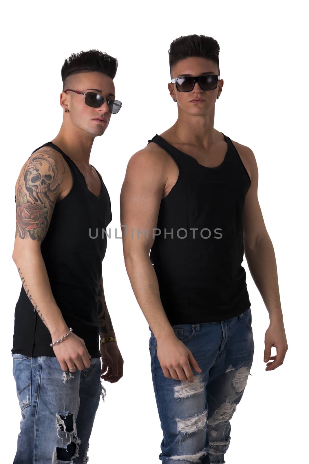 Two hip trendy male friends in studio shot isolated on white background