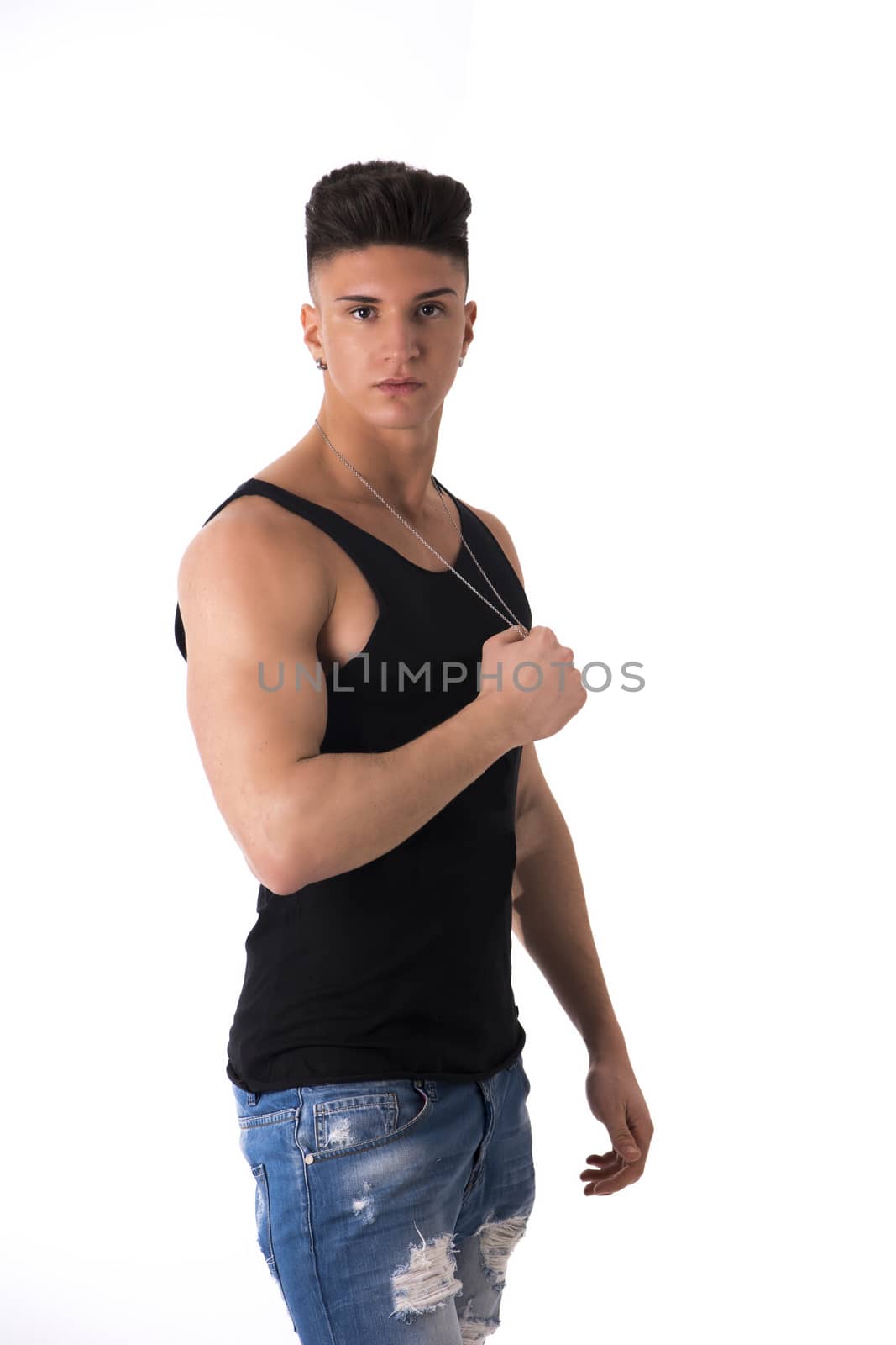 Profile portrait of trendy young man with tank top, holding necklace, isolated on white