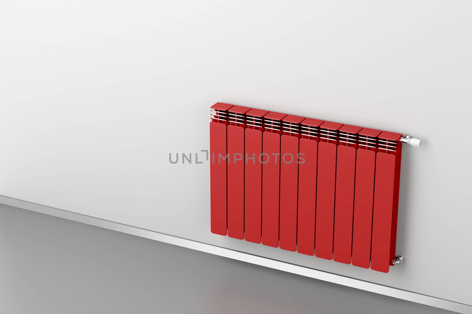 Red heating radiator attached on grey wall 