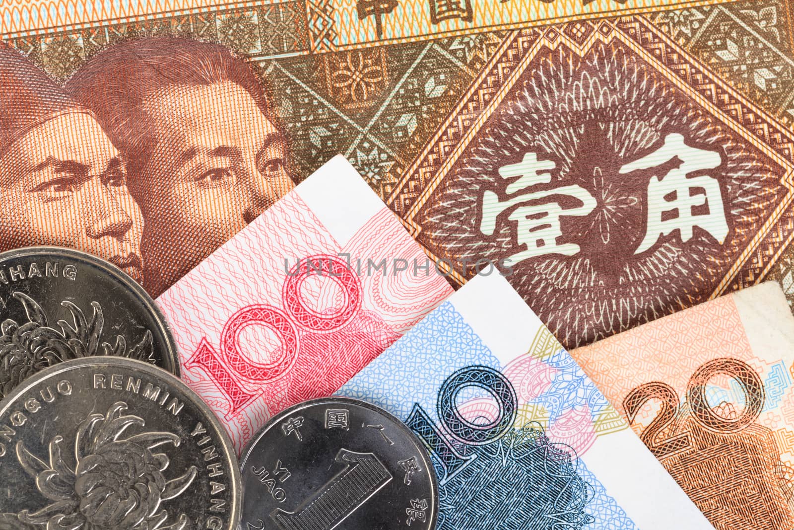 Chinese or Yuan banknotes money and coins from China's currency, close up view as background