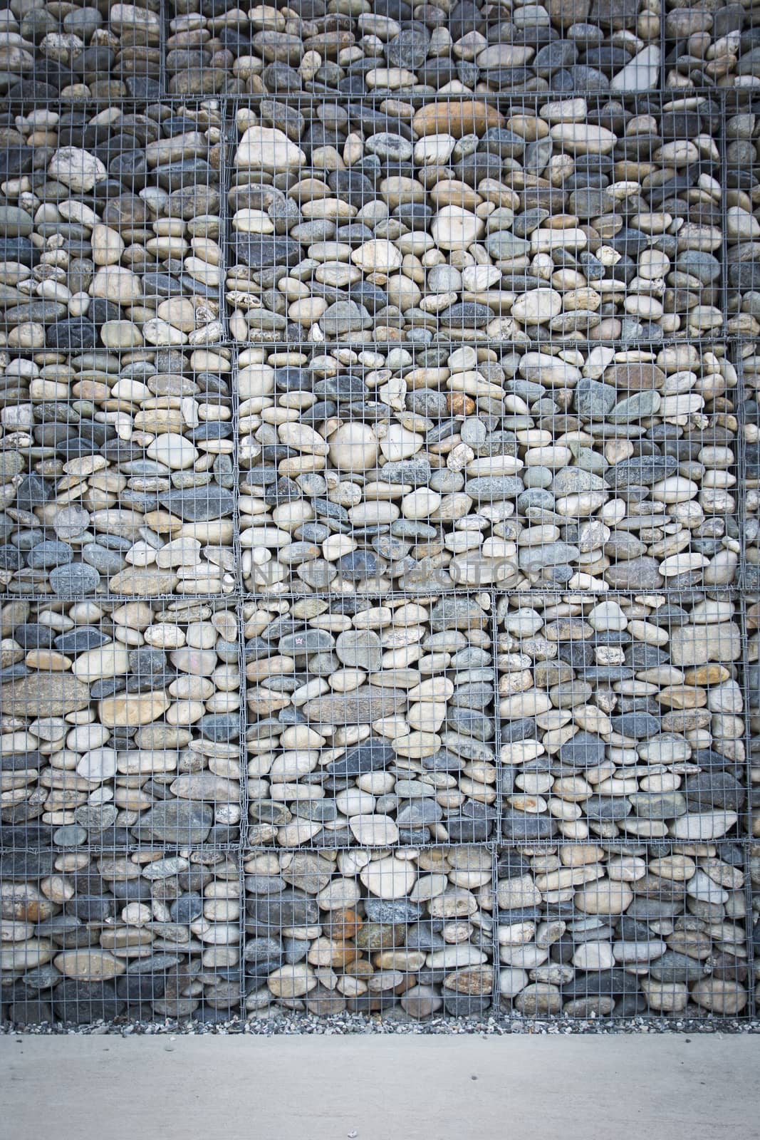 Empty wall made of stones and concrete pavement by artofphoto