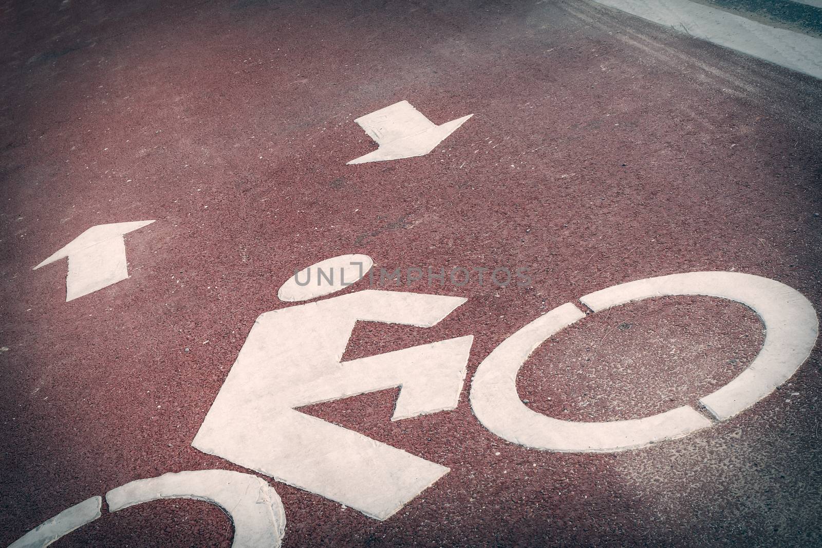 Bicycle lane or path, icon symbol on red asphalt road by FrameAngel