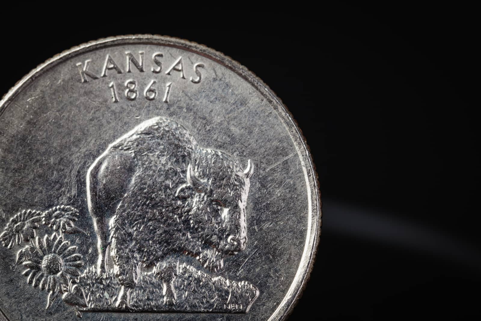 US American coin with wording "KANSAS 1861" on black background