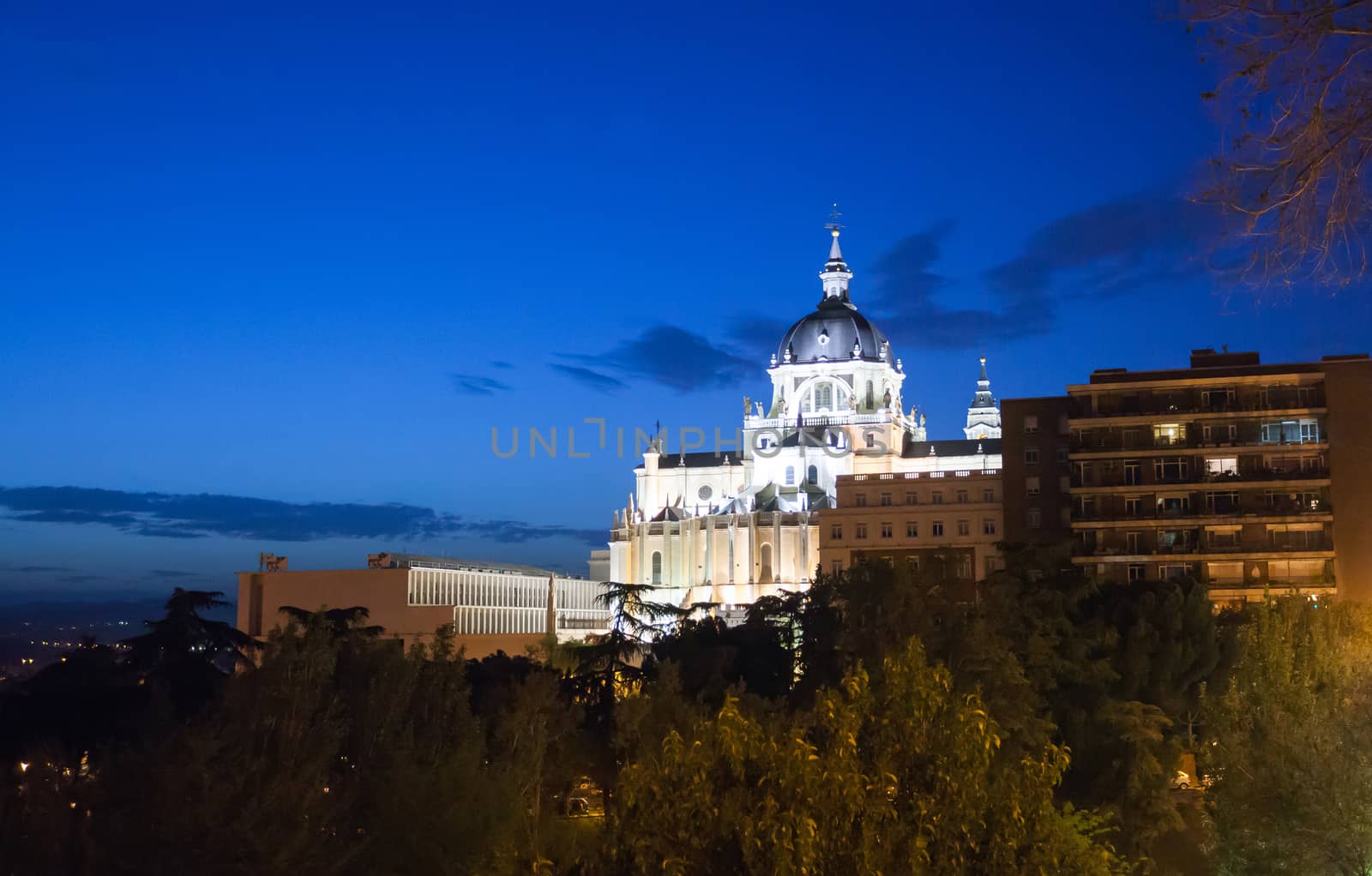 Madrid, Spain - May 10, 2012: Pope John Paul II statue in front of Cathedral Almudena on a spring night in Madrid, Spain