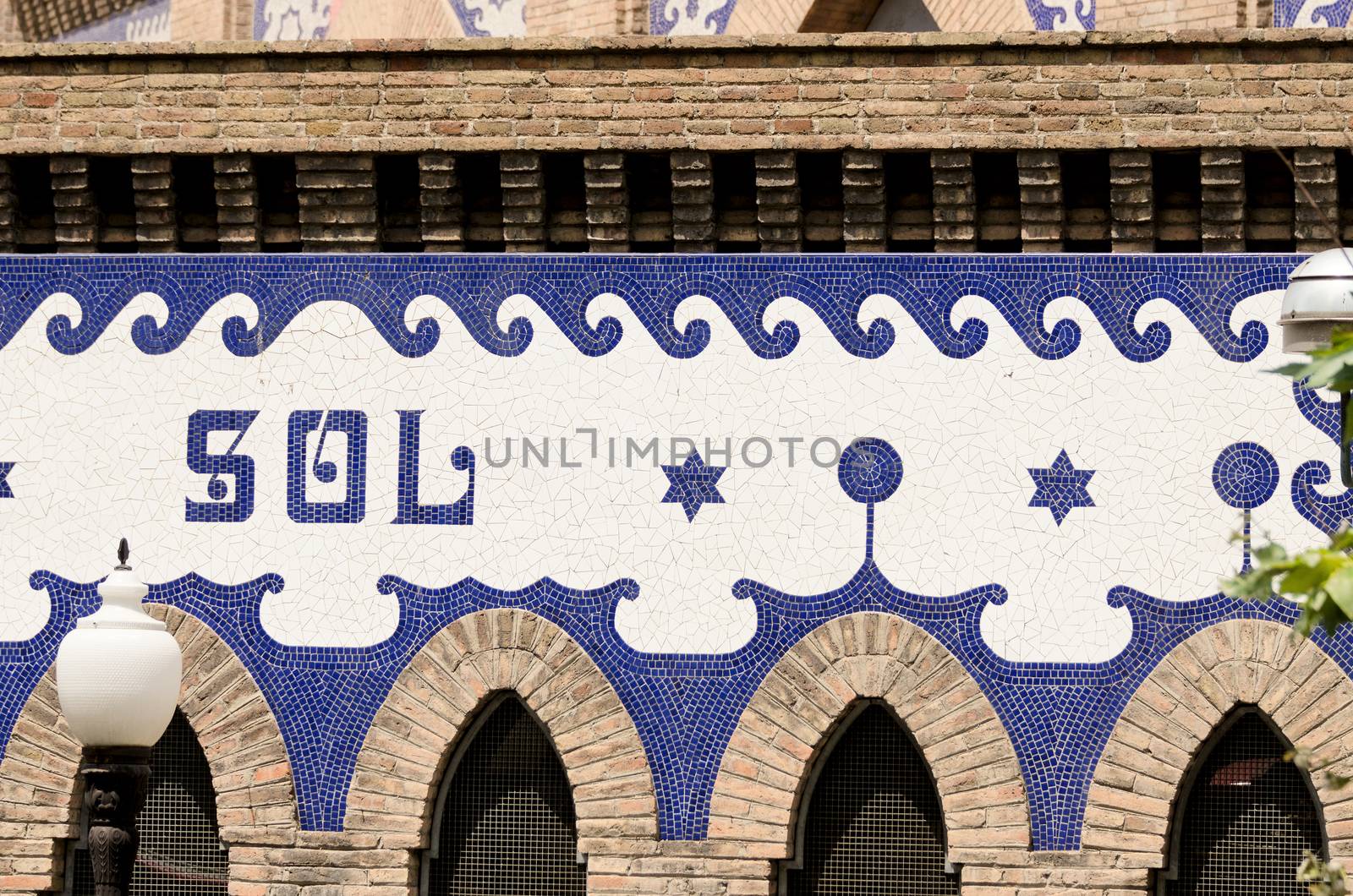 Architectural details of mosaic building wall in Madrid Spain