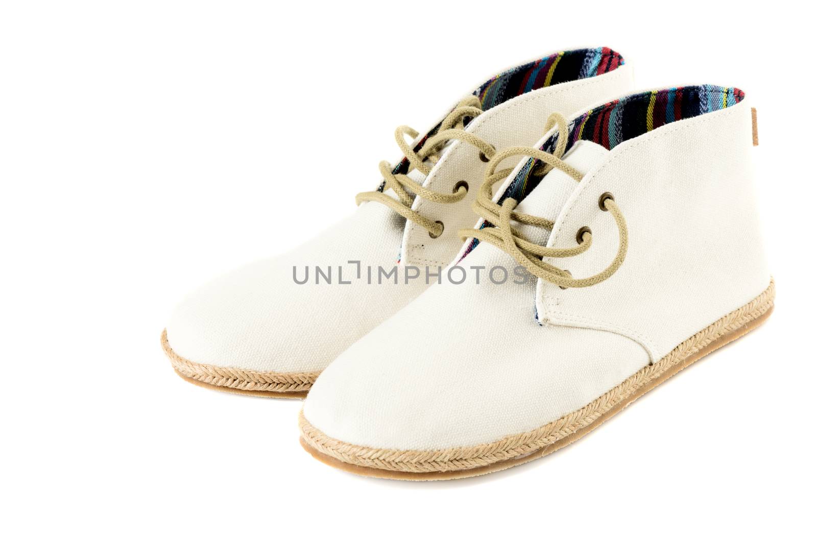 Pair of trendy canvas shoes isolated on white right view by Nanisimova