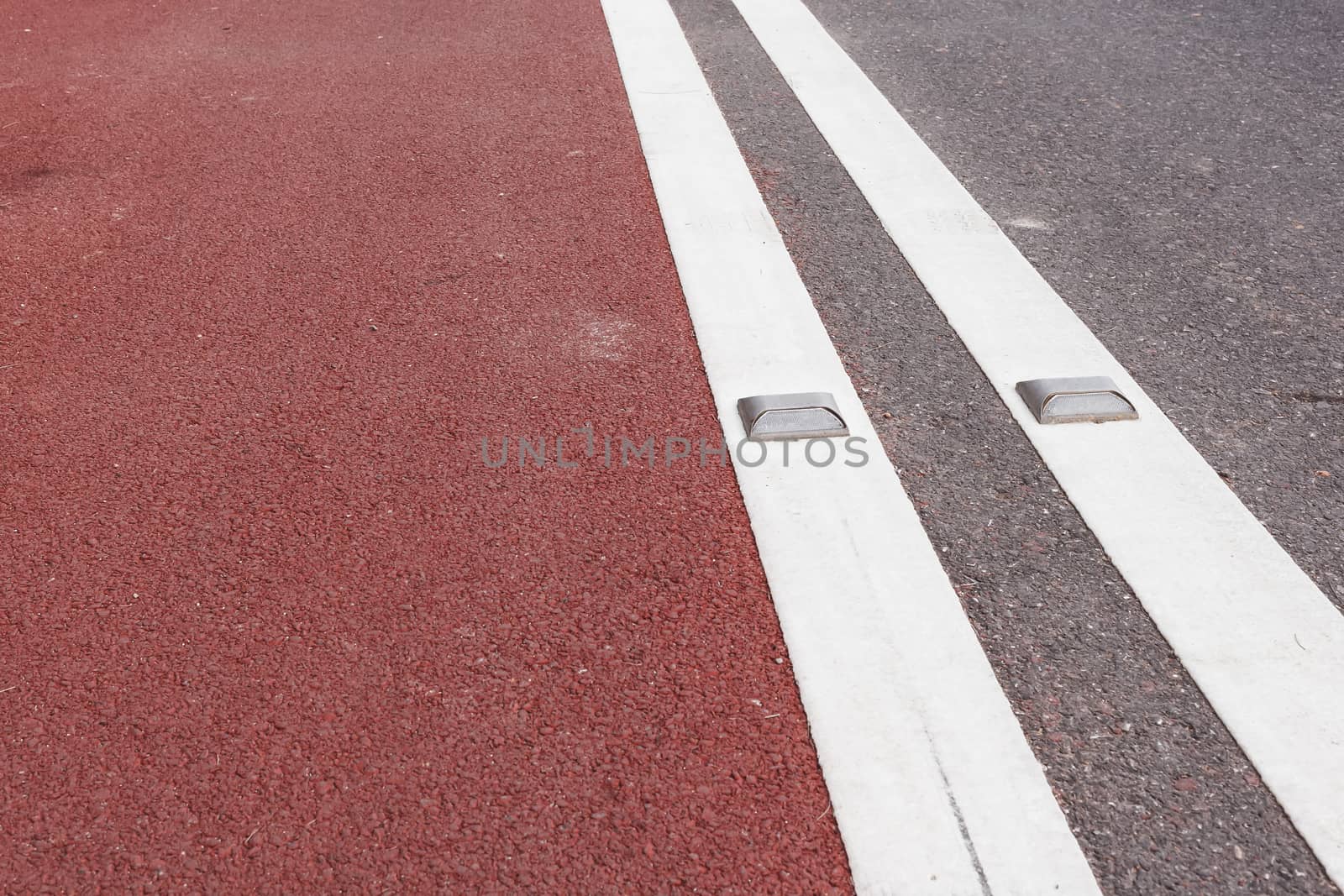 road stud with white reflector and red path