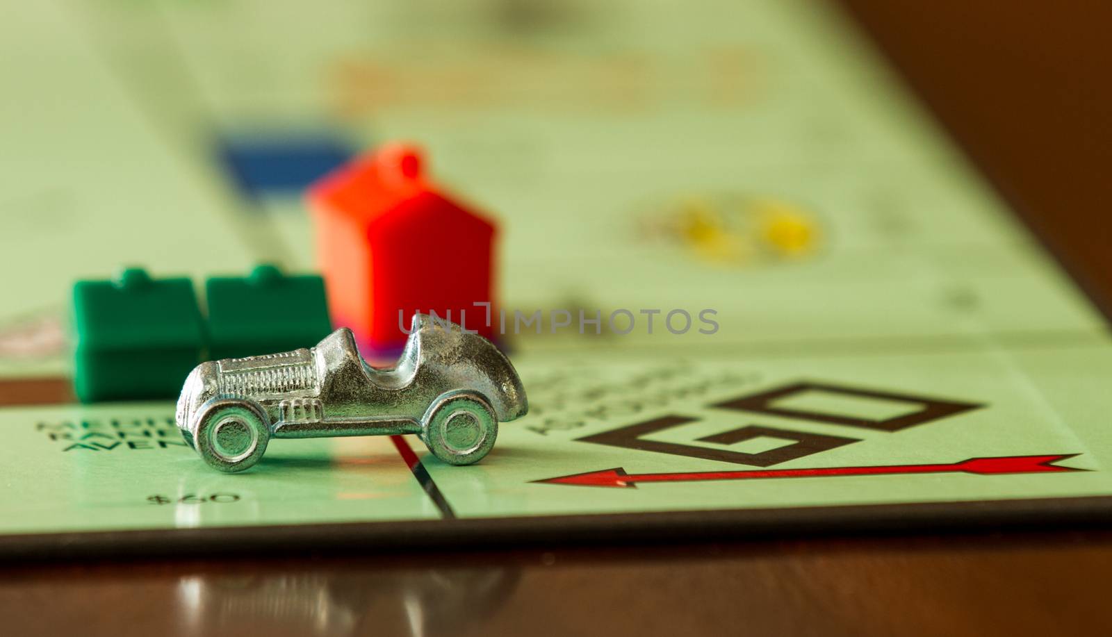 BOISE, IDAHO - NOVEMBER 18, 2012: Car from the game Monopoly speeding past. Game was made by Parker Brothers now owned by Hasbro