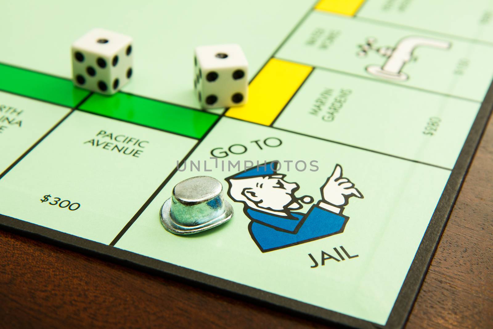 BOISE, IDAHO - NOVEMBER 18, 2012: Showing the hat on the go to jail spot on the famous Hasbro game Monopoly.