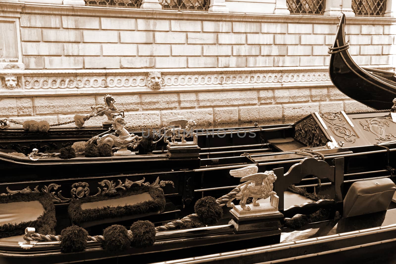 Italy. Venice. Details of typical venitian gondolas. The winged lion and golden horse on a venetian gondola. In Sepia toned. Retro style