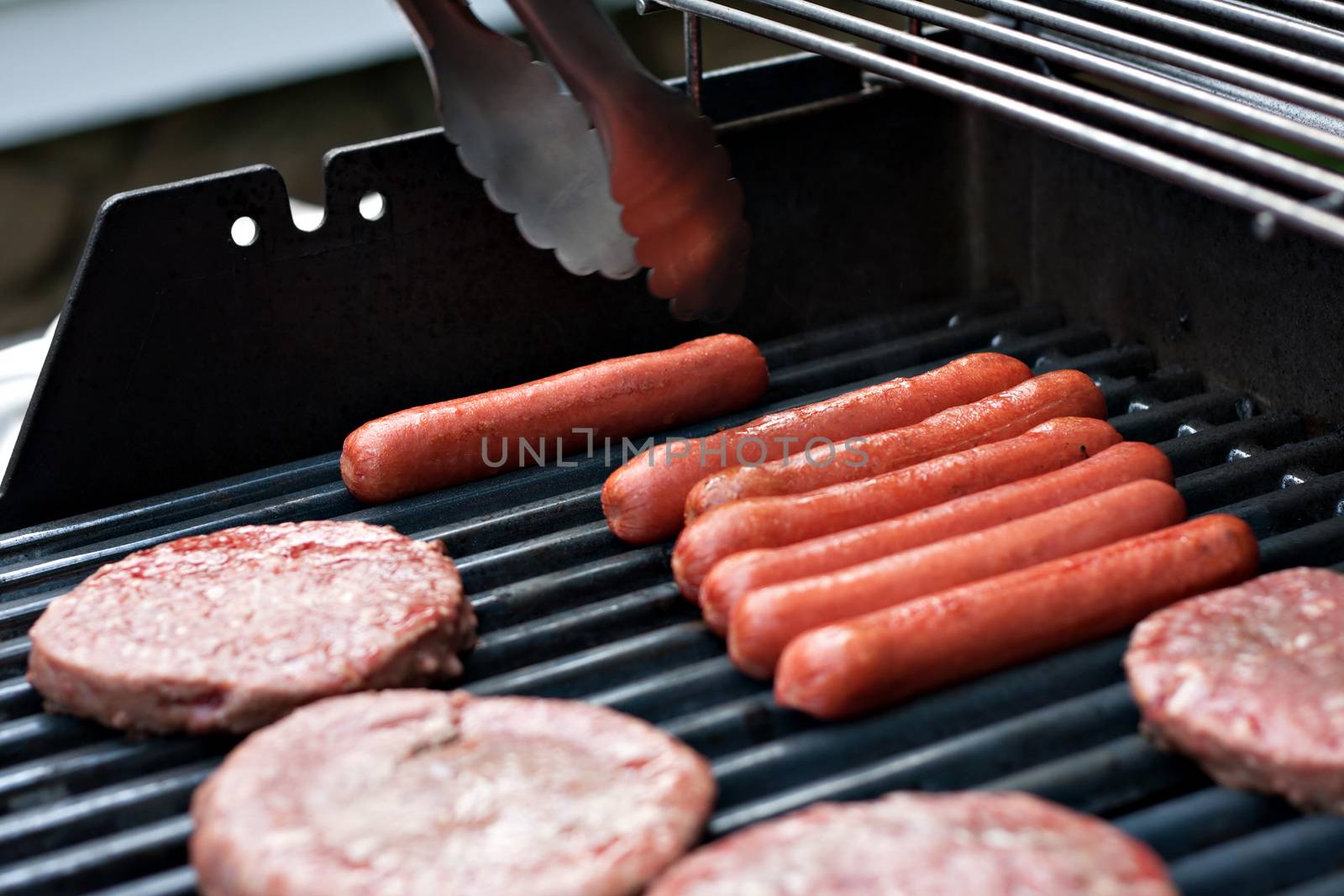 Hot Dogs and Hamburgers on the Grill by graficallyminded
