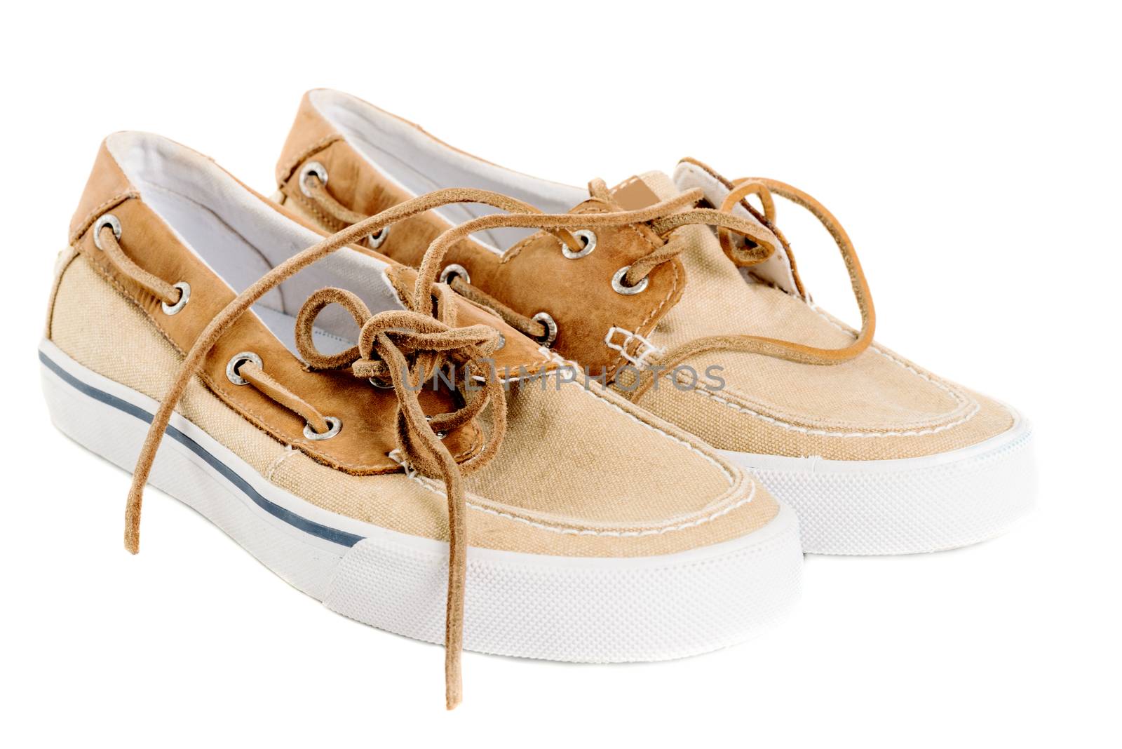 Pair of boat shoes isolated on white left side view by Nanisimova