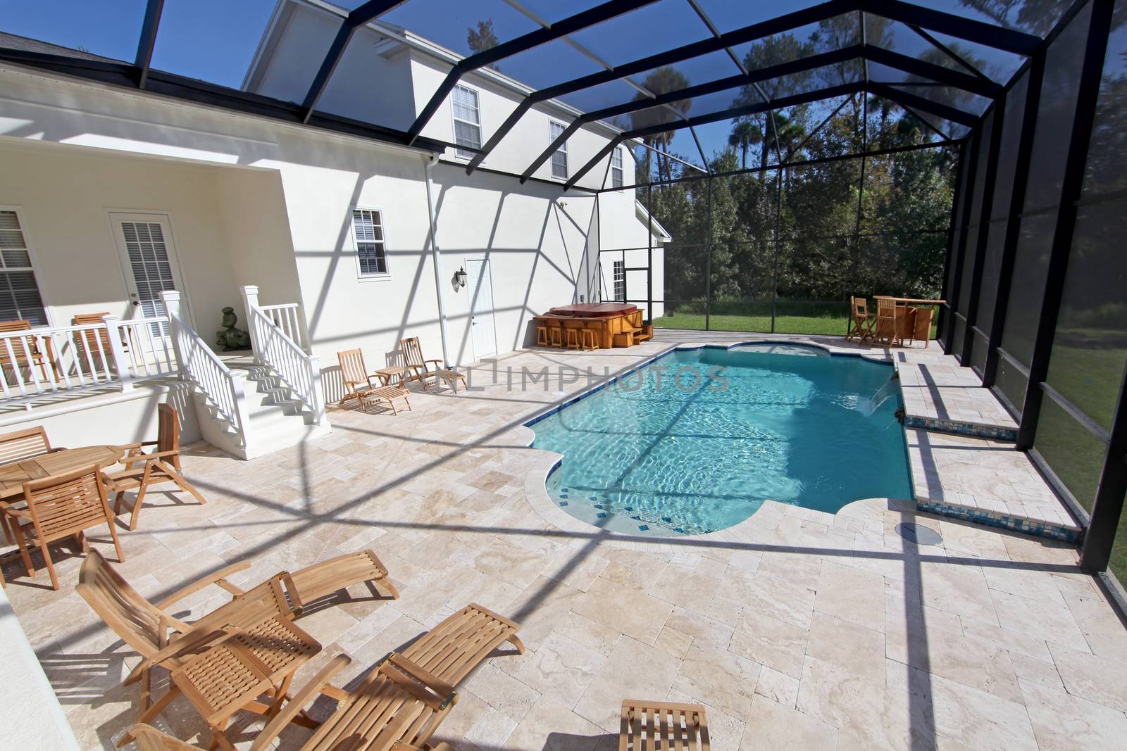 A swimming pool and hot tub at a large home