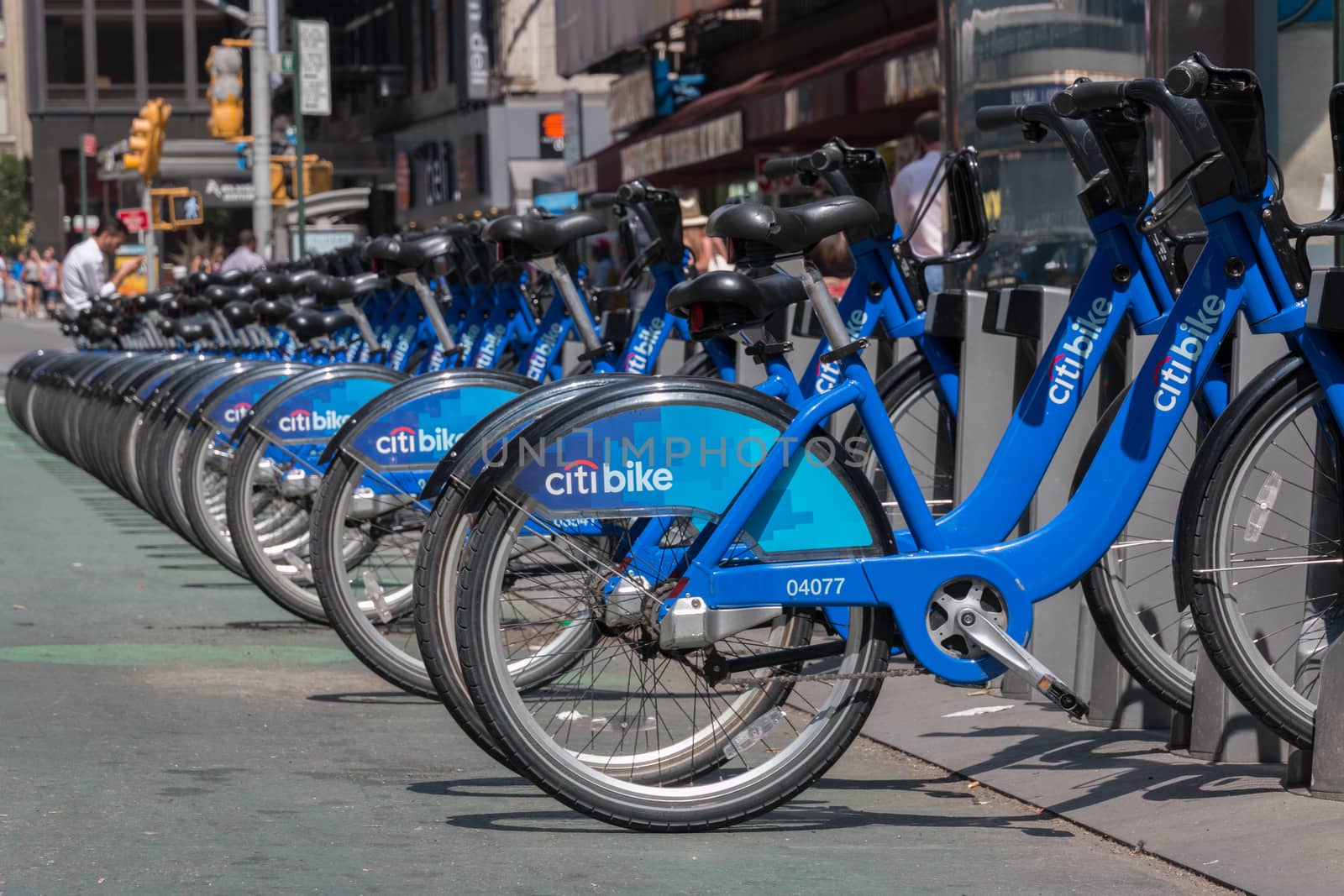 New York - Aug 20: several bicycles from city bike parked in a row waiting to be hired  in downtown New York on August 20, 2014 in New York, USA