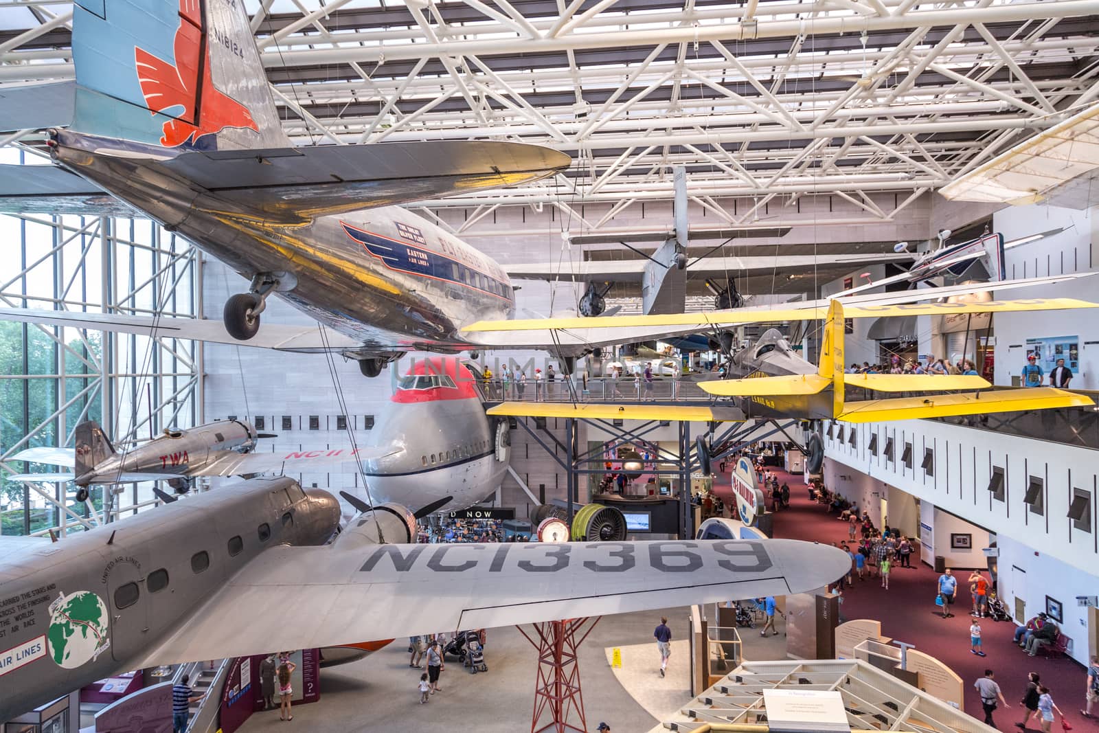 Washington DC, Aug 26: Pitcairn Mailwing, DC-3, Boeing 747 and several other aircrafts hang on display at the Smithsonian Natural Air and Space Museum on August 26 2014, Washington DC, USA.