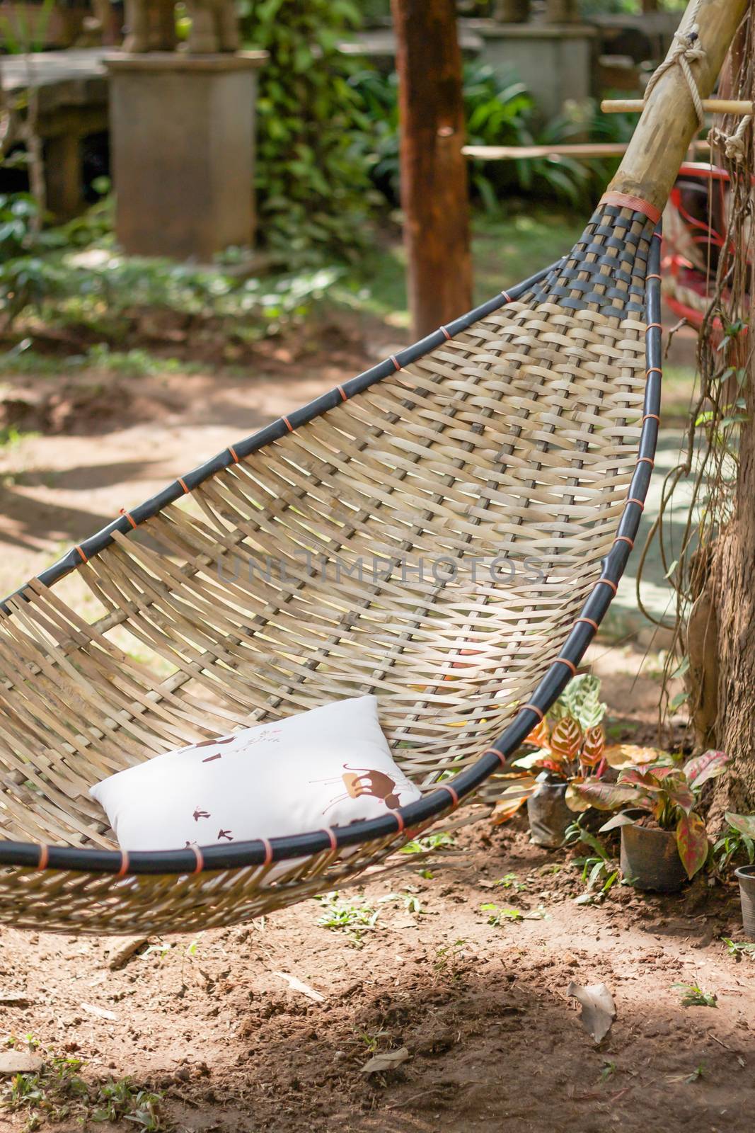 Vintage stylized hammock in garden by punsayaporn