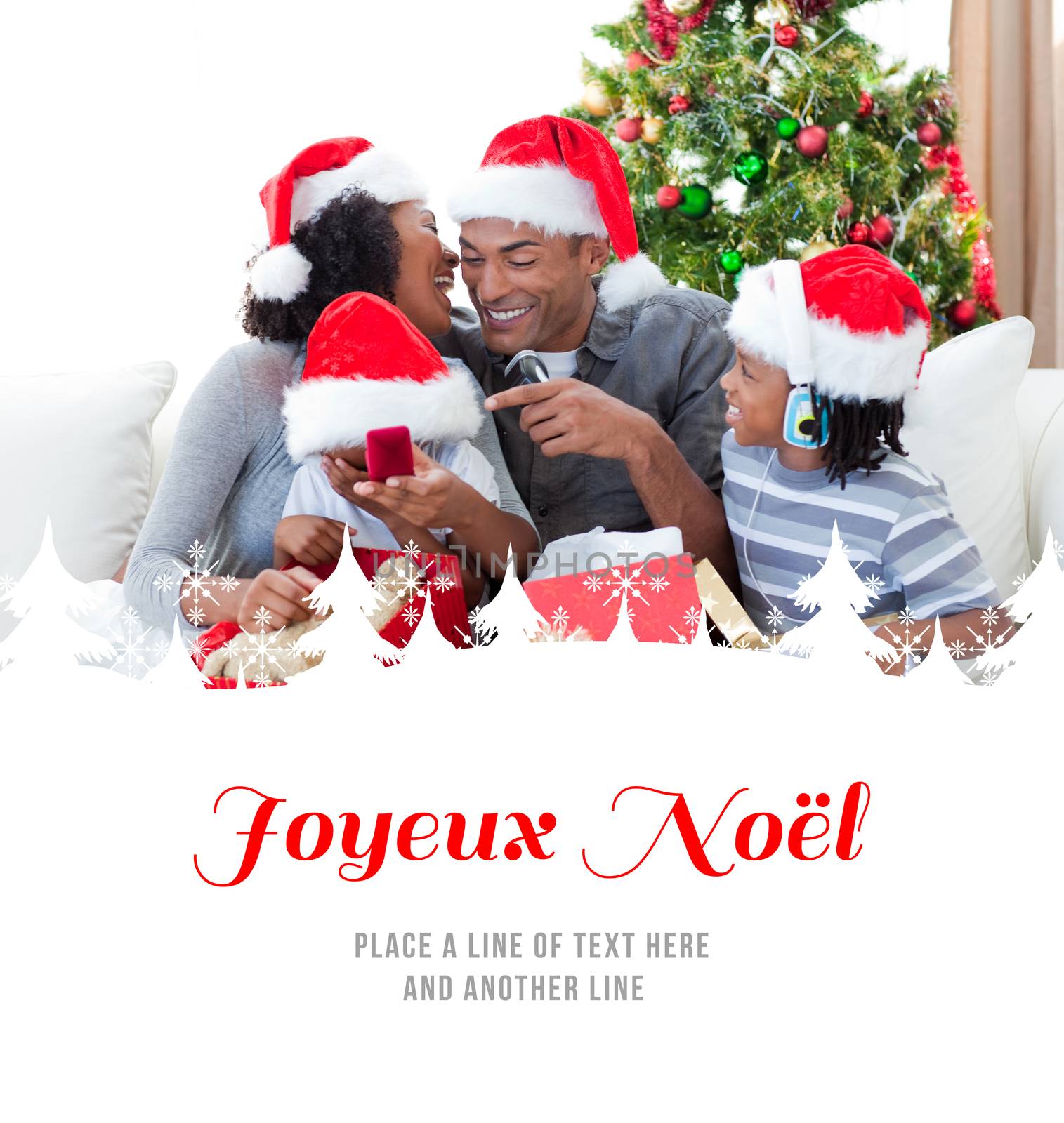 Happy family having fun with Christmas presents against joyeux noel