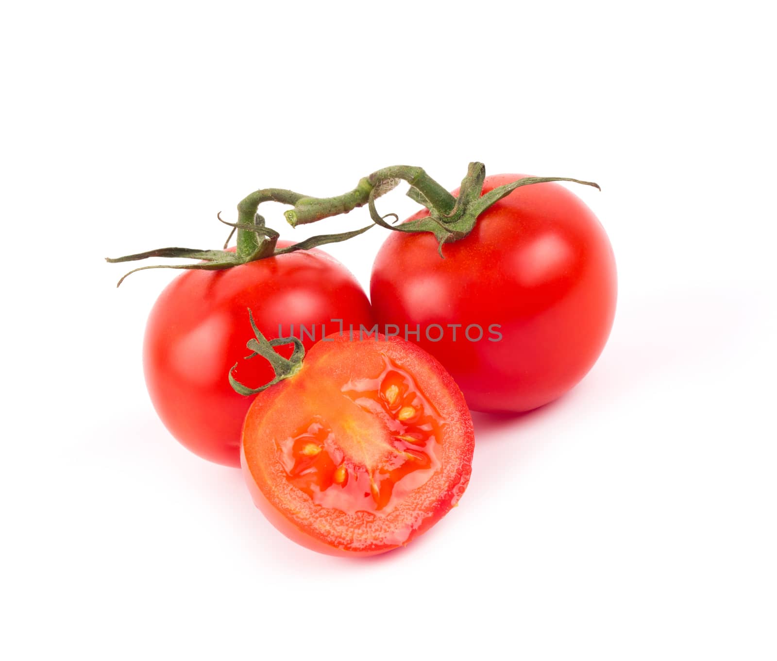 Fresh tomatoes isolated on white