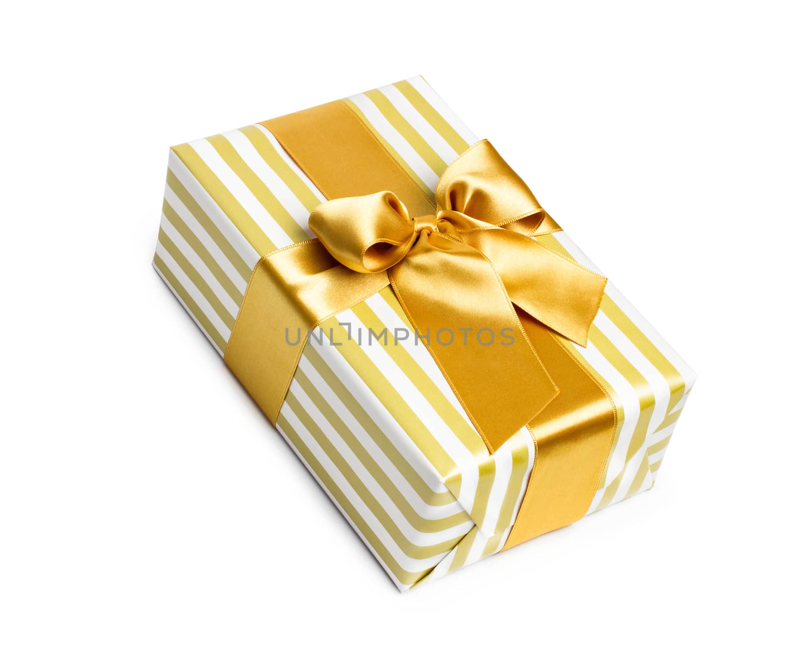 Gift box in gold duo tone with golden satin ribbon and bow isolated over white background.