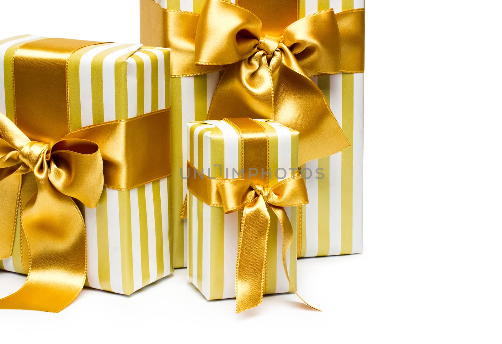 Gold gift boxes isolated on white background