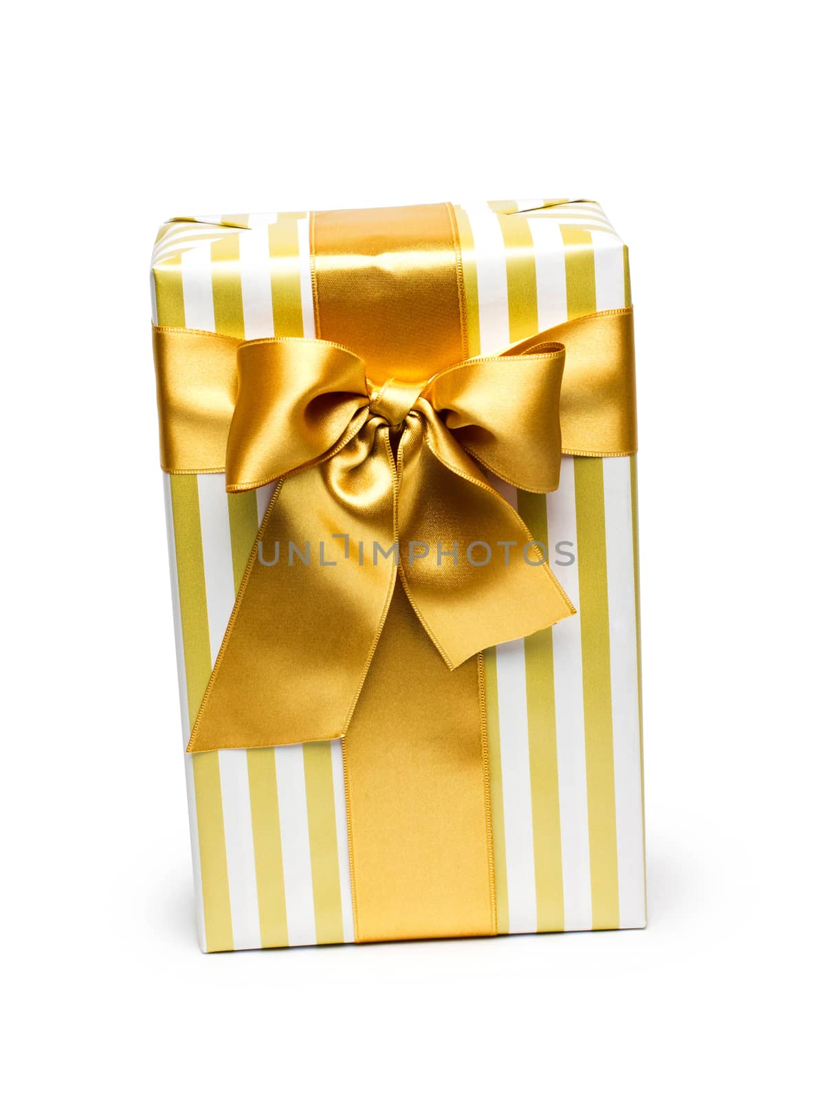 Gift box in gold duo tone with golden satin ribbon and bow isolated over white background.