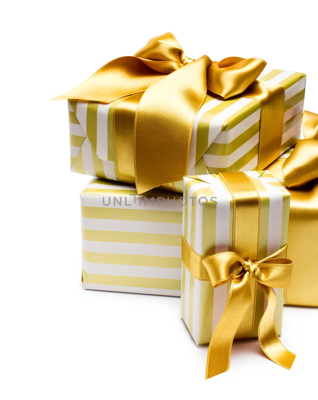 Gold gift boxes isolated on white background