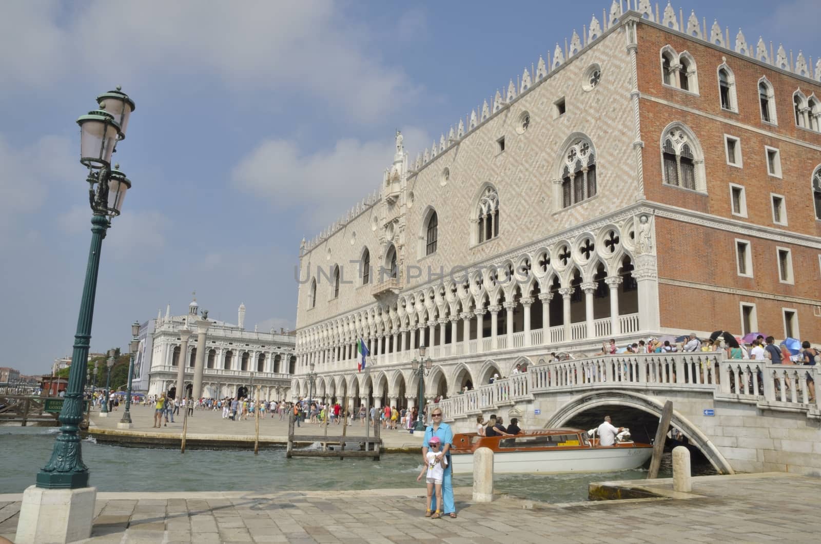 People around the Doge Palace,  built in Venetian Gothic style, and one of the main landmarks of the city of Venice, northern Italy. 