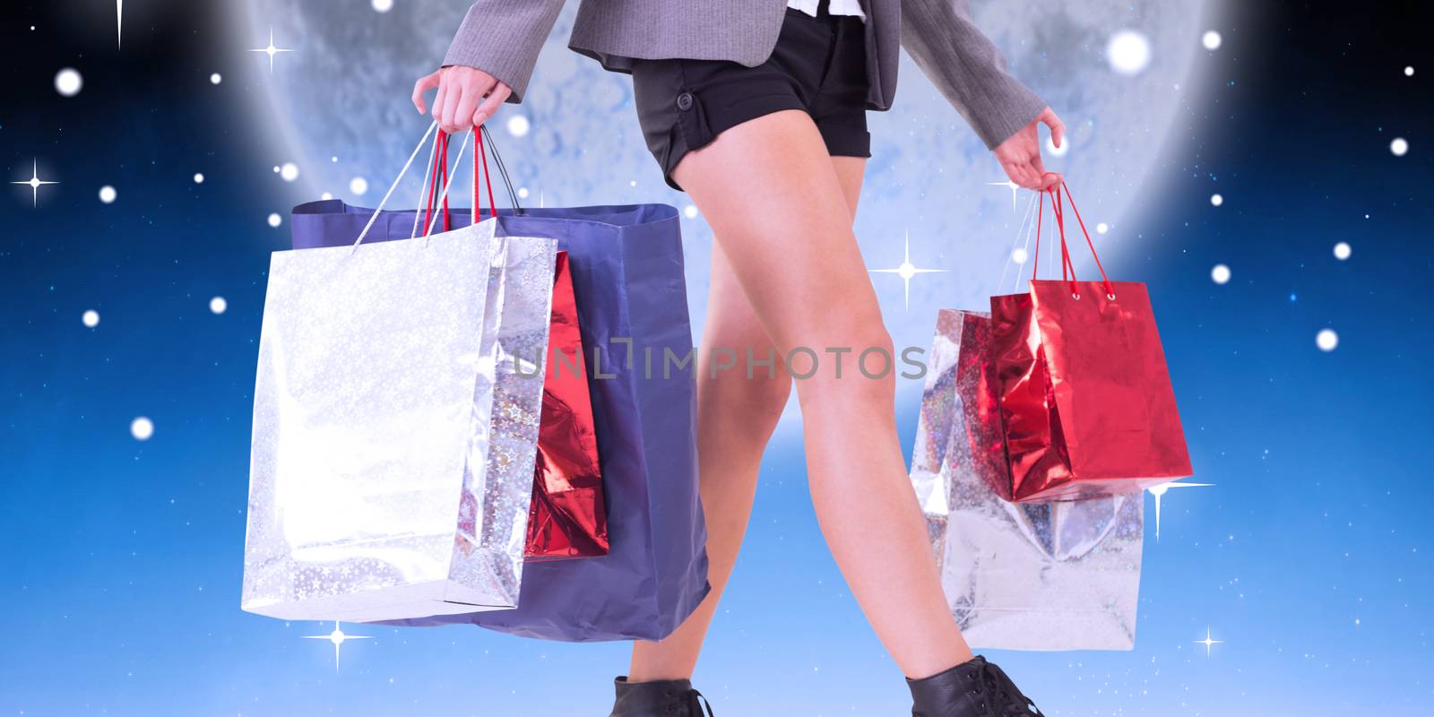 Composite image of lower half of woman with shopping bags by Wavebreakmedia