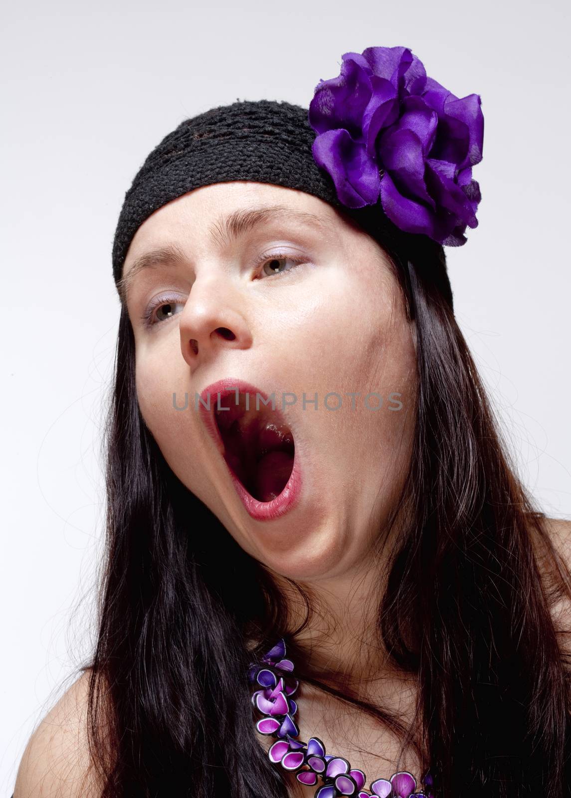 Bored Young Woman Yawning with Open Mouth by courtyardpix