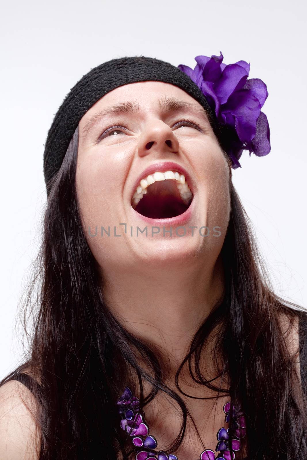 Young Woman with Spontaneous Toothy Laughter - Isolated on White