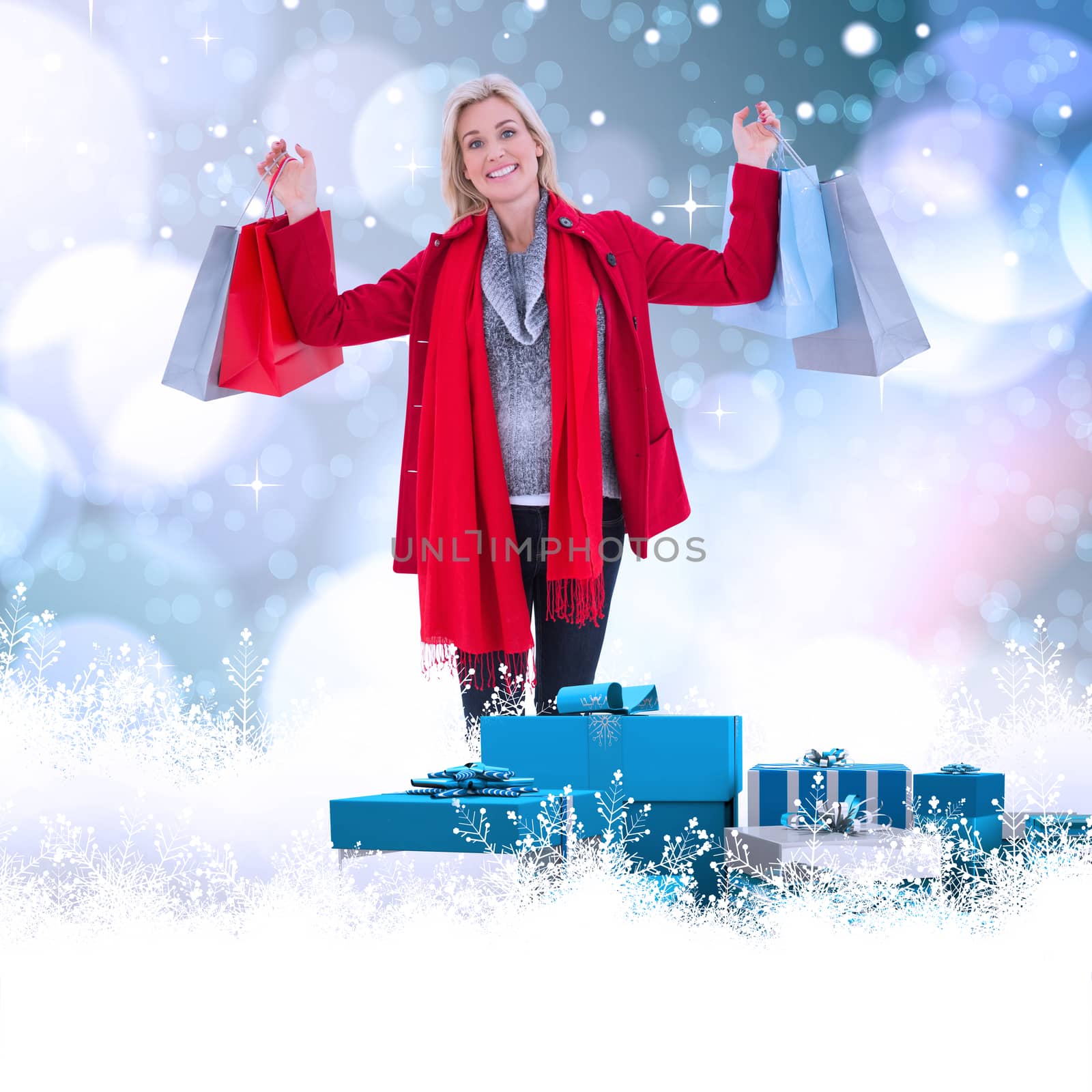 Blonde in winter clothes holding shopping bags against light glowing dots on blue