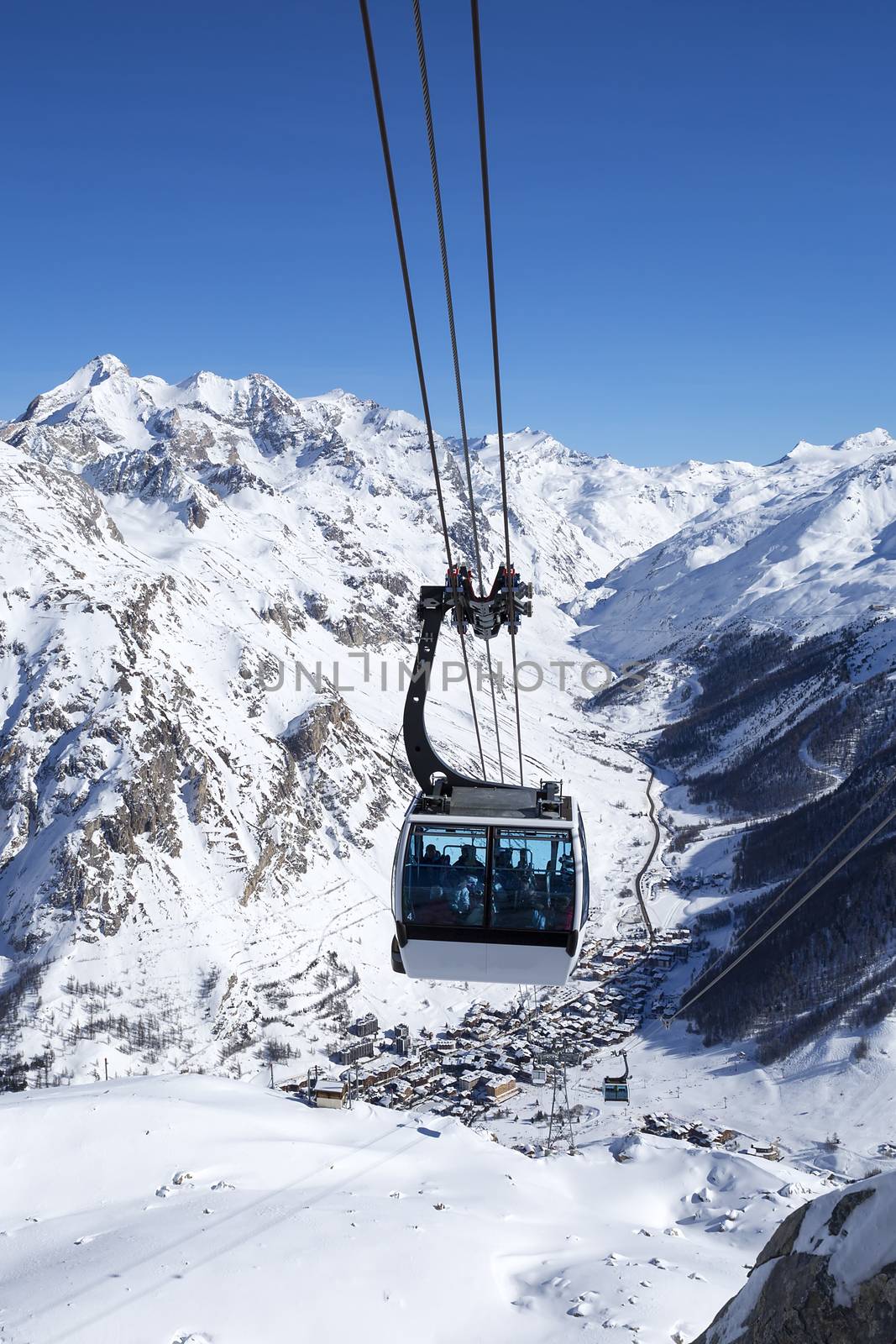 A cable way with cable cars in a mountain area, France.