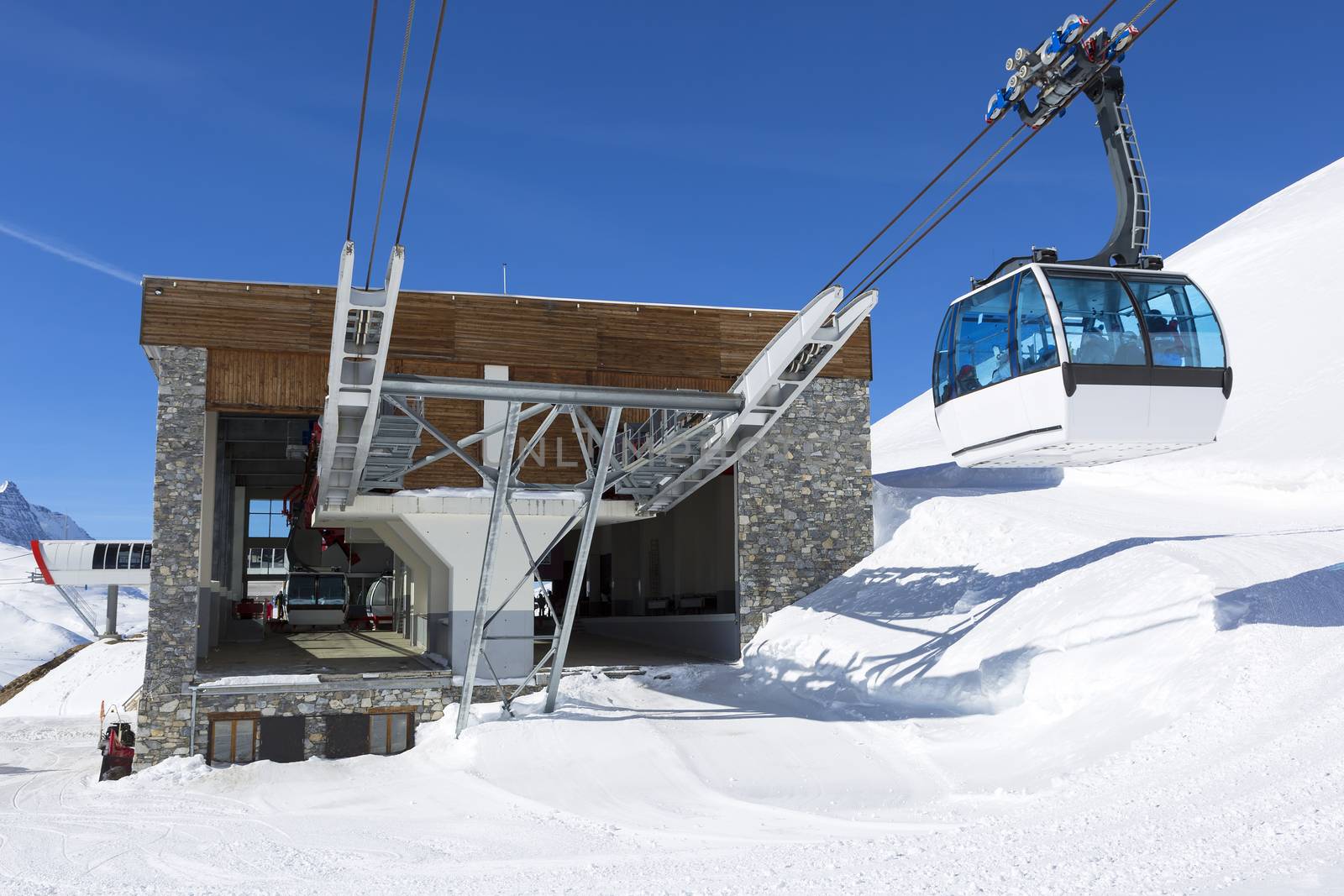 A cable way with cable cars in a mountain area