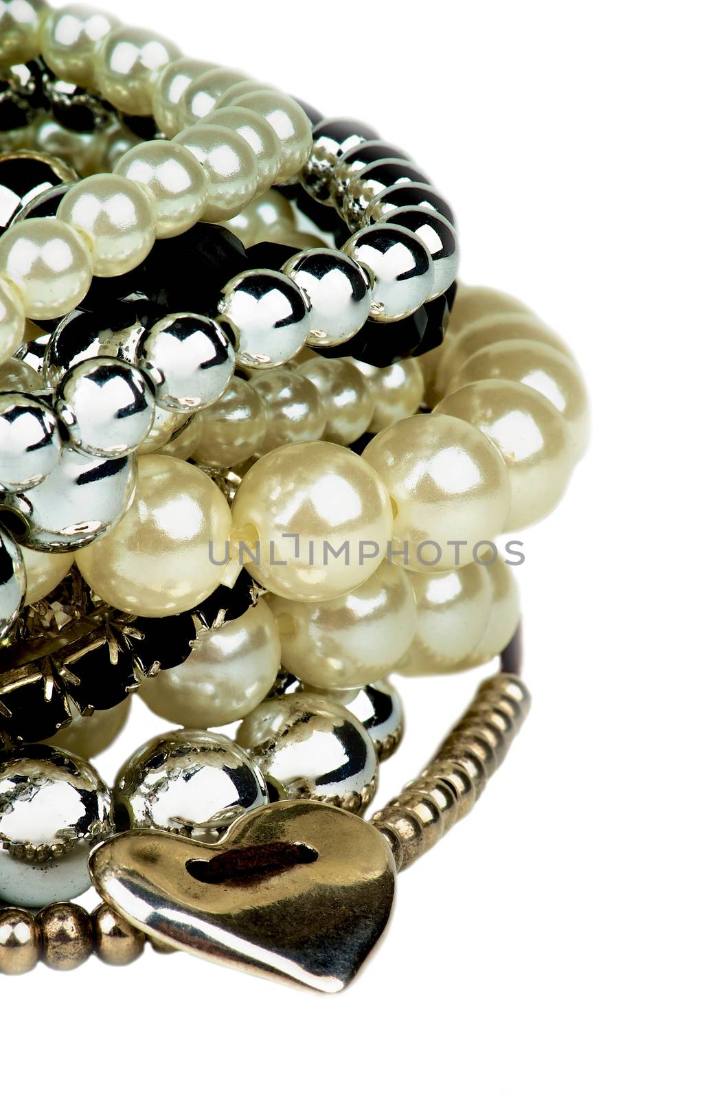 Stack of Various Pearl, Silver and Black Jewelry Gems Bracelets with Silver Heart Shape closeup