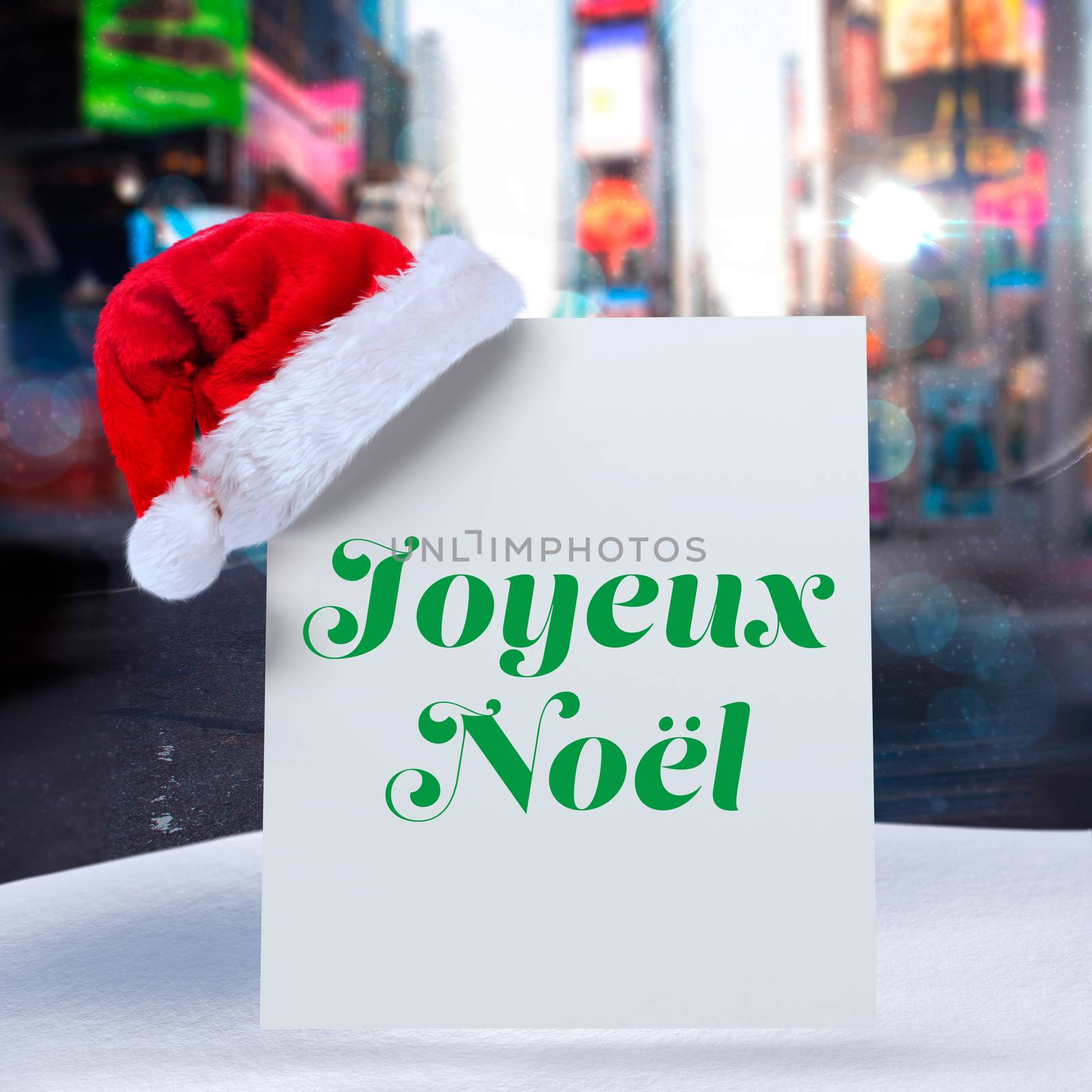 Joyeux noel against blurry new york street