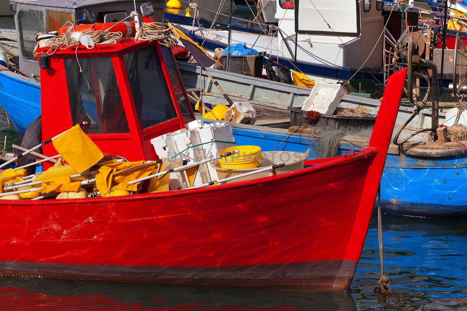 Small fishing boats with fishing equipment docked in the port - Lerici, La Spezia, Liguria, Italy