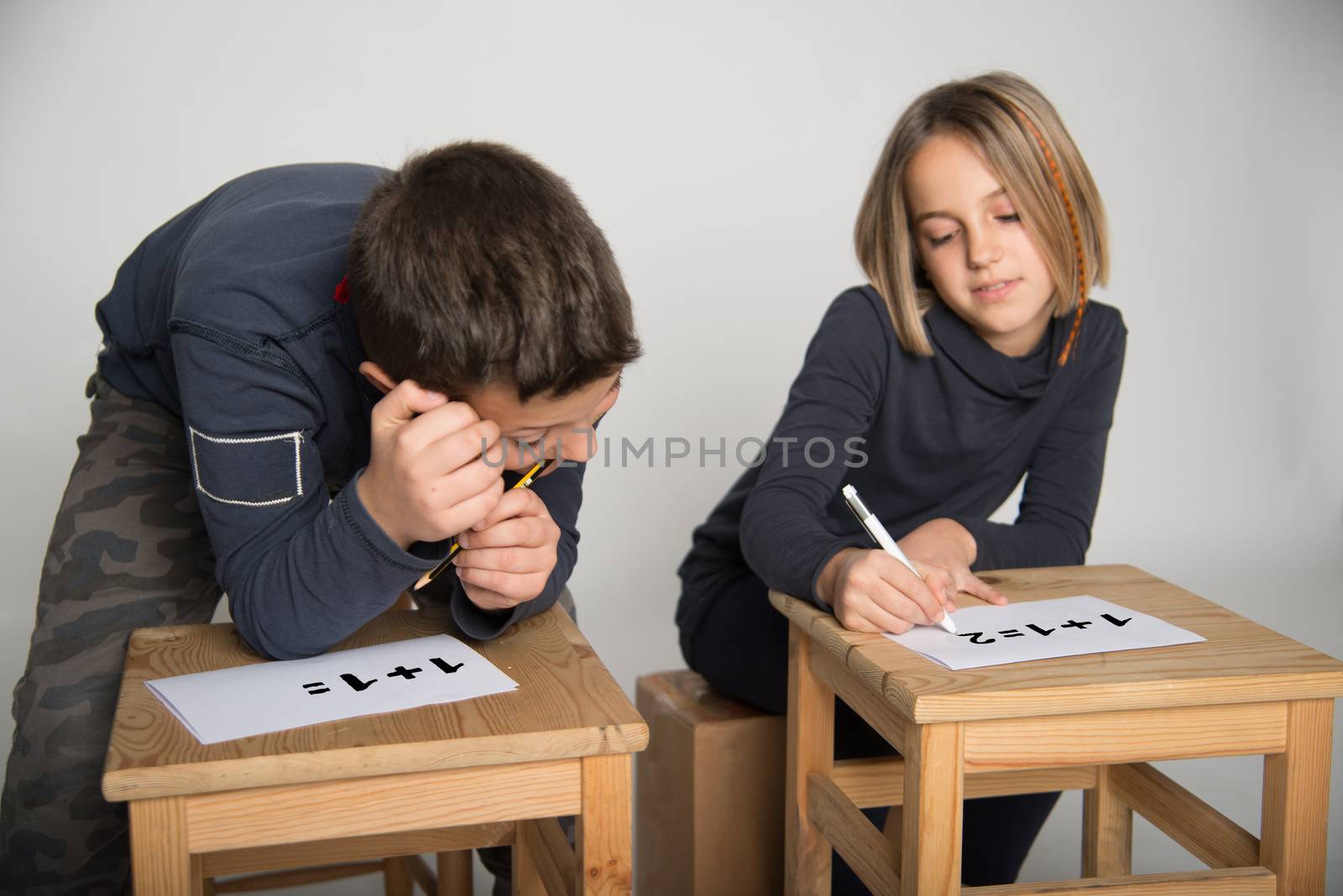 Children intent on solving a problem of calculation