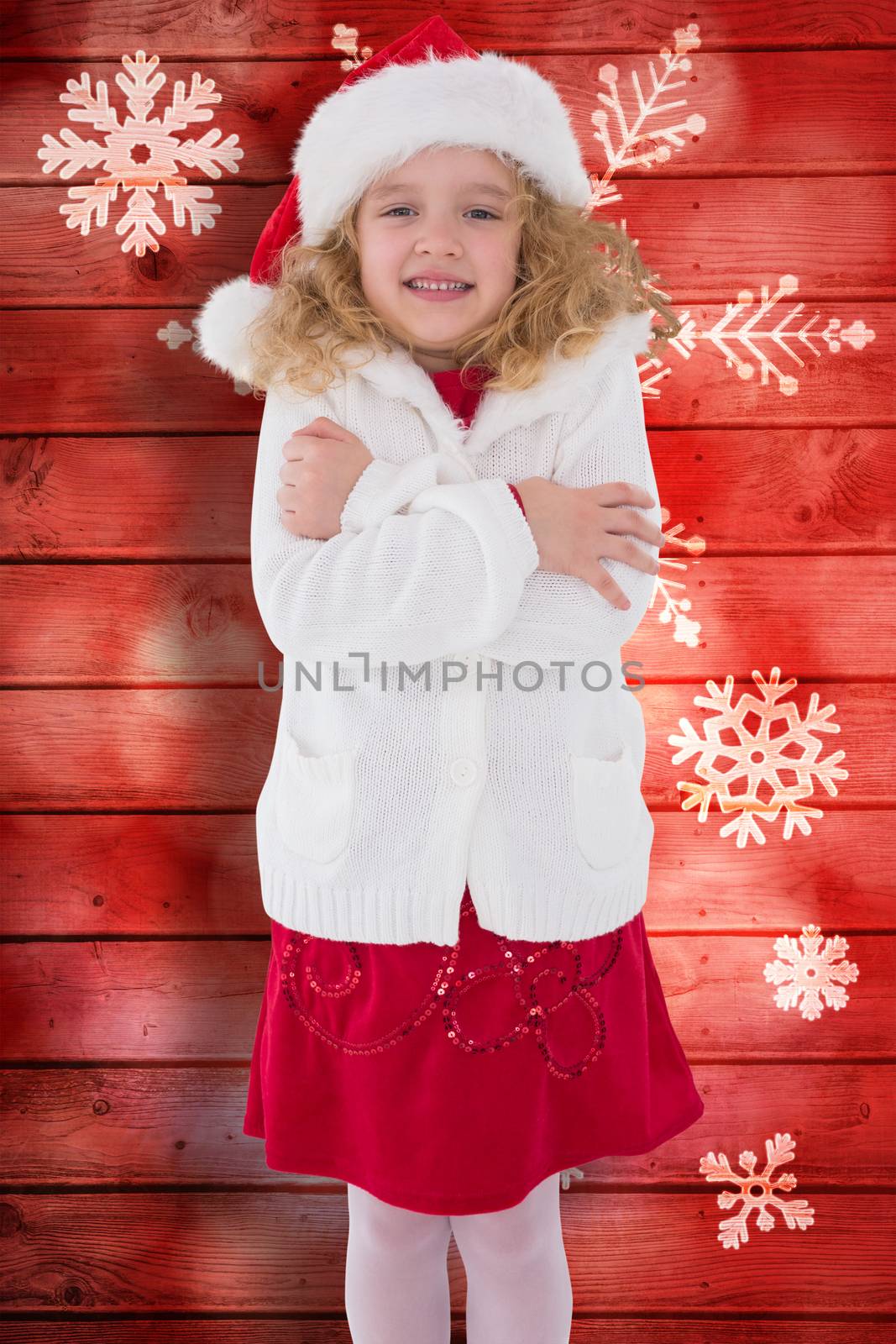 Composite image of festive little girl smiling at camera by Wavebreakmedia