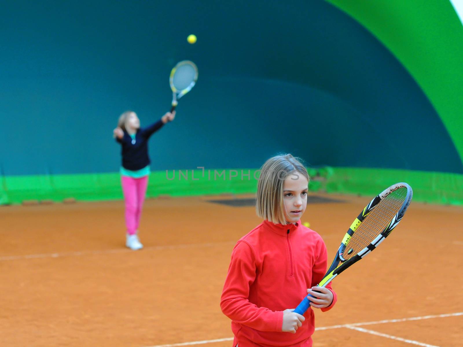 Children at school during a dribble of tennis