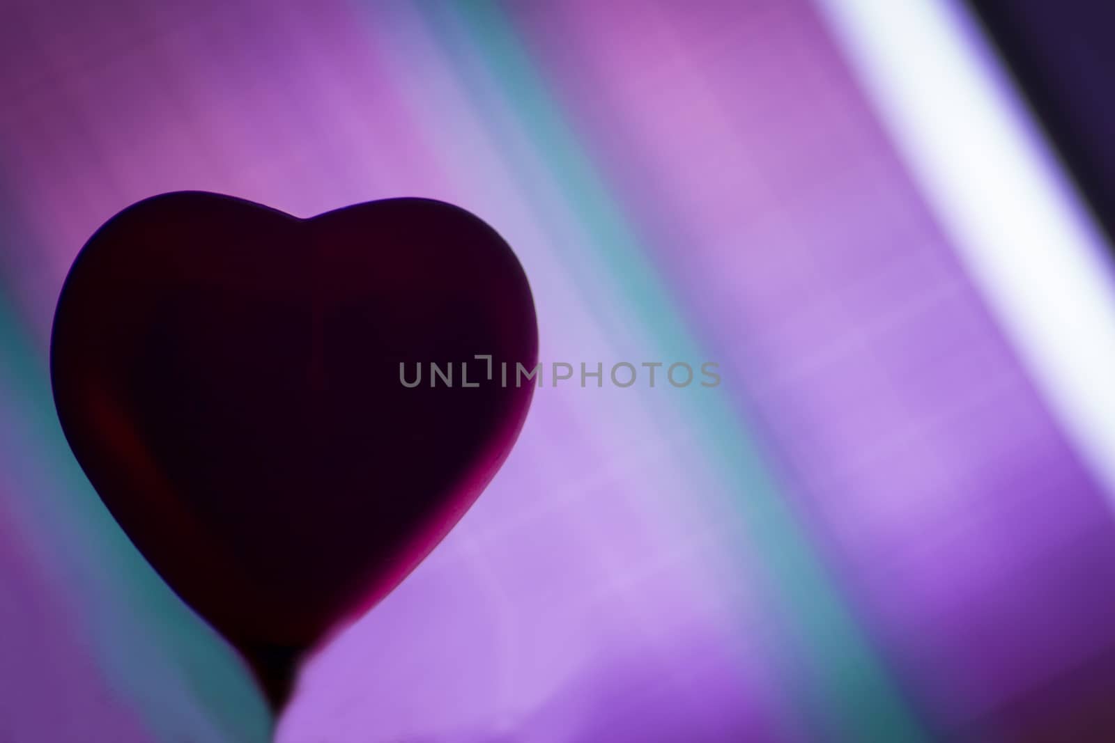Heart Silhouette. Background in several bright colors.