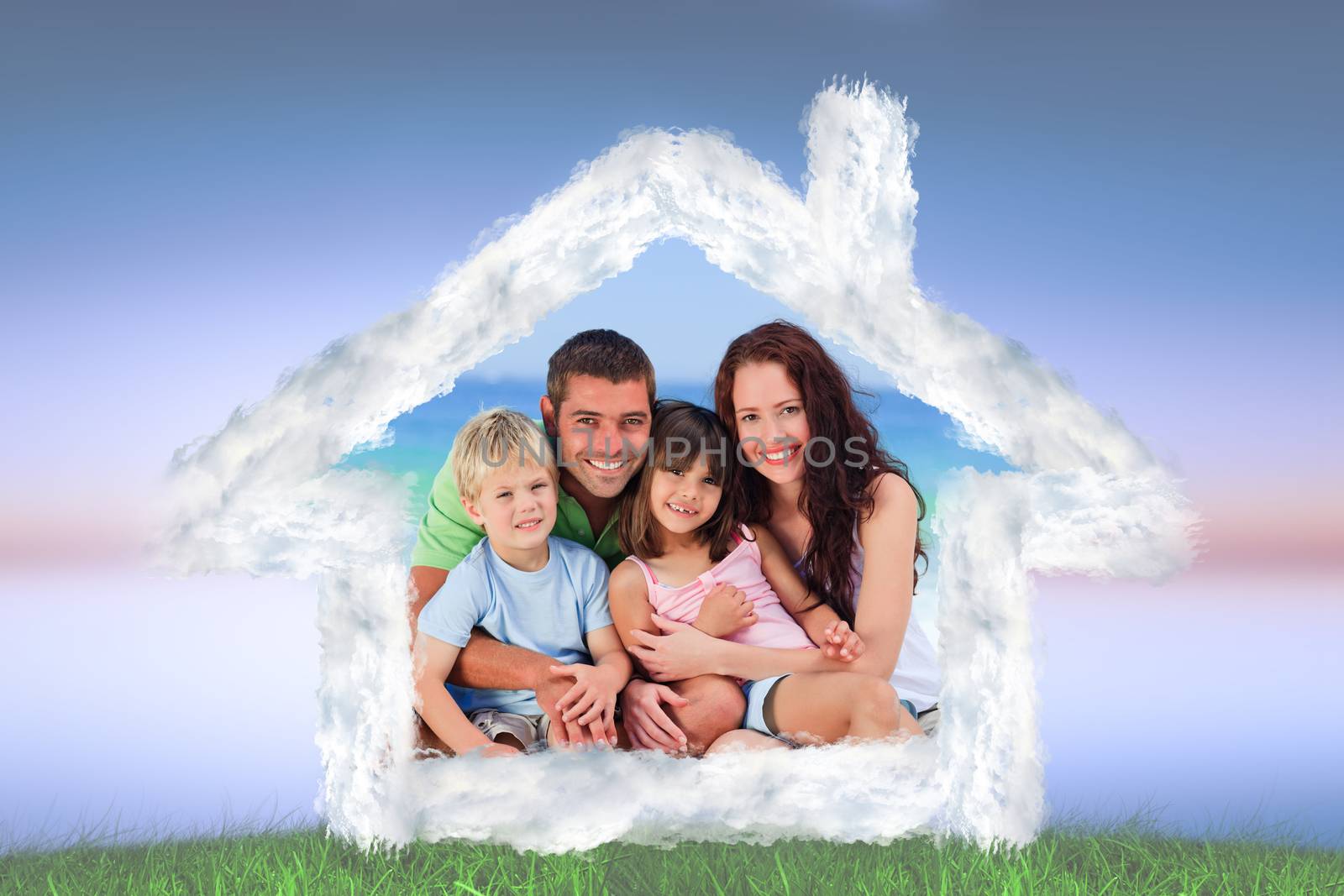 Portrait of a family at the beach against green grass under blue and purple sky