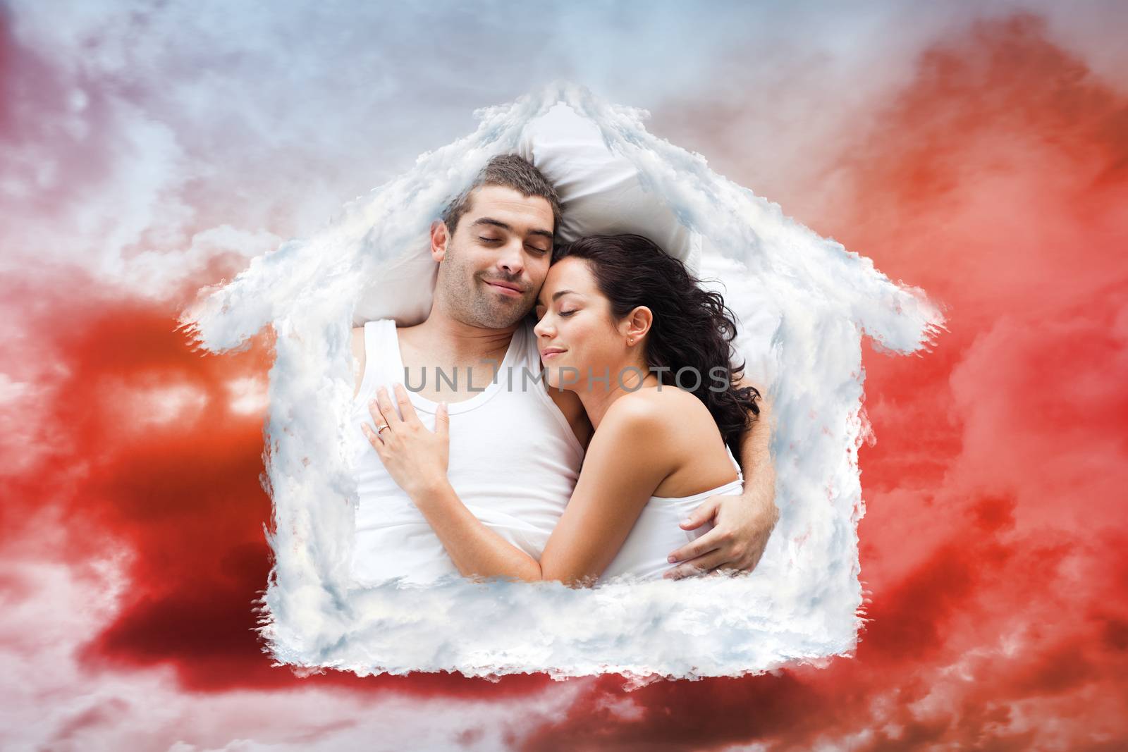 Composite image of beautiful couple lying on a bed by Wavebreakmedia