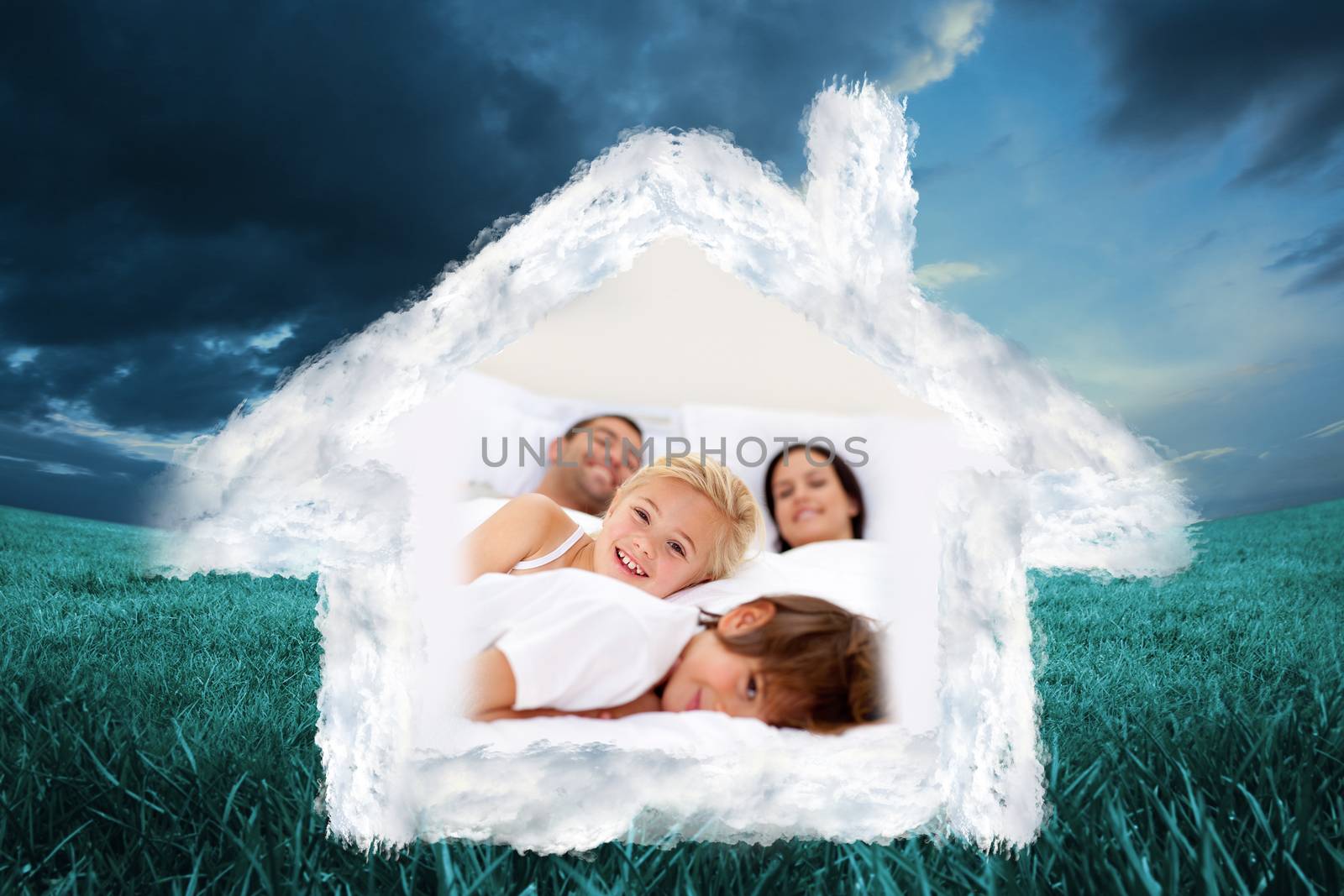 Composite image of family realxing in parents bed by Wavebreakmedia