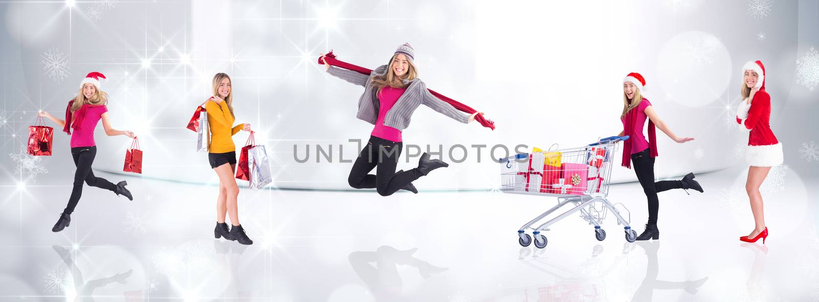 Festive blonde carrying gift bags against snowflakes in room