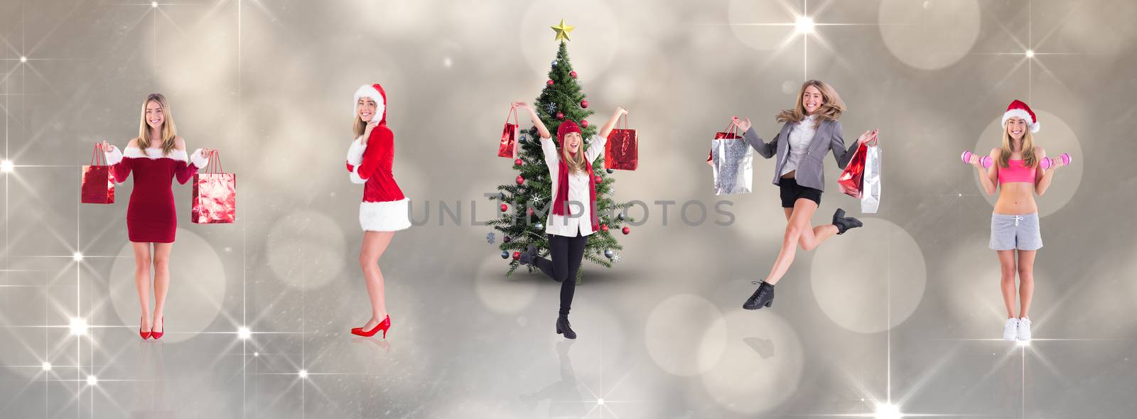 Festive fit blonde holding dumbbells against shimmering light design on grey